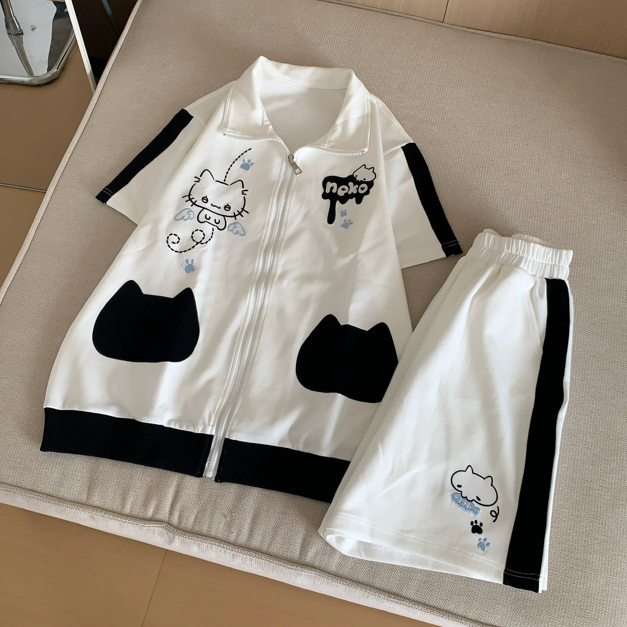 Jirai Kei pocket shorts detailed product photography showing stretchy elastic waist, dual side pockets, and cat print coordination with sweatshirt matching