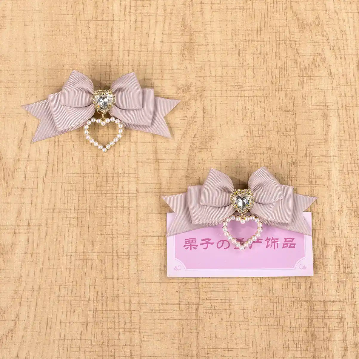 Grey pink love heart Jirai Kei hair clip pair with mixed rhinestone details contemporary subculture style