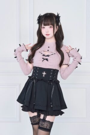Pink ribbed Jirai Kei knit top with black ruffle skirt corset detail front view - sweet subculture fashion ensemble