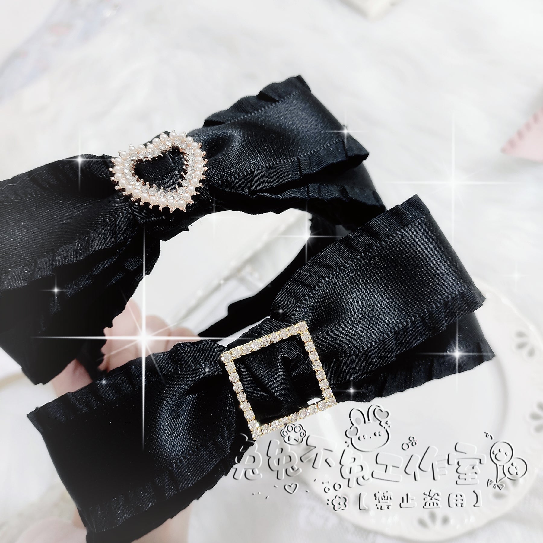 Close-up Jirai Kei bow headbands with heart and square rhinestone accents on white fur background