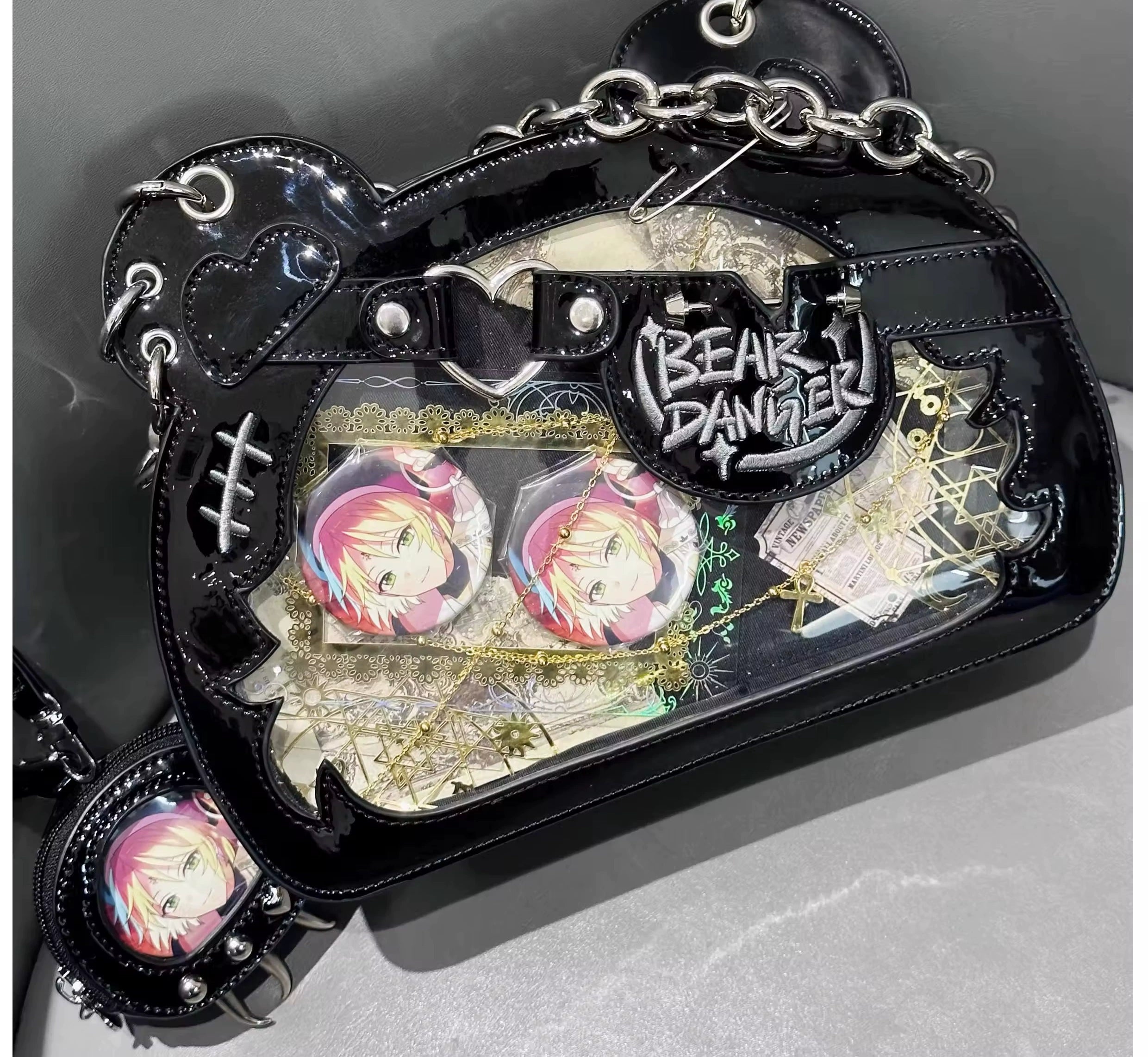 Bear-shaped jirai kei ita bag detailed view showing transparent badge display window, punk metal accessories, and quality construction