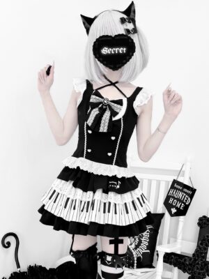 Full front studio view of gothic lolita halter dress with cat ear headpiece and black-white piano keyboard patterned skirt