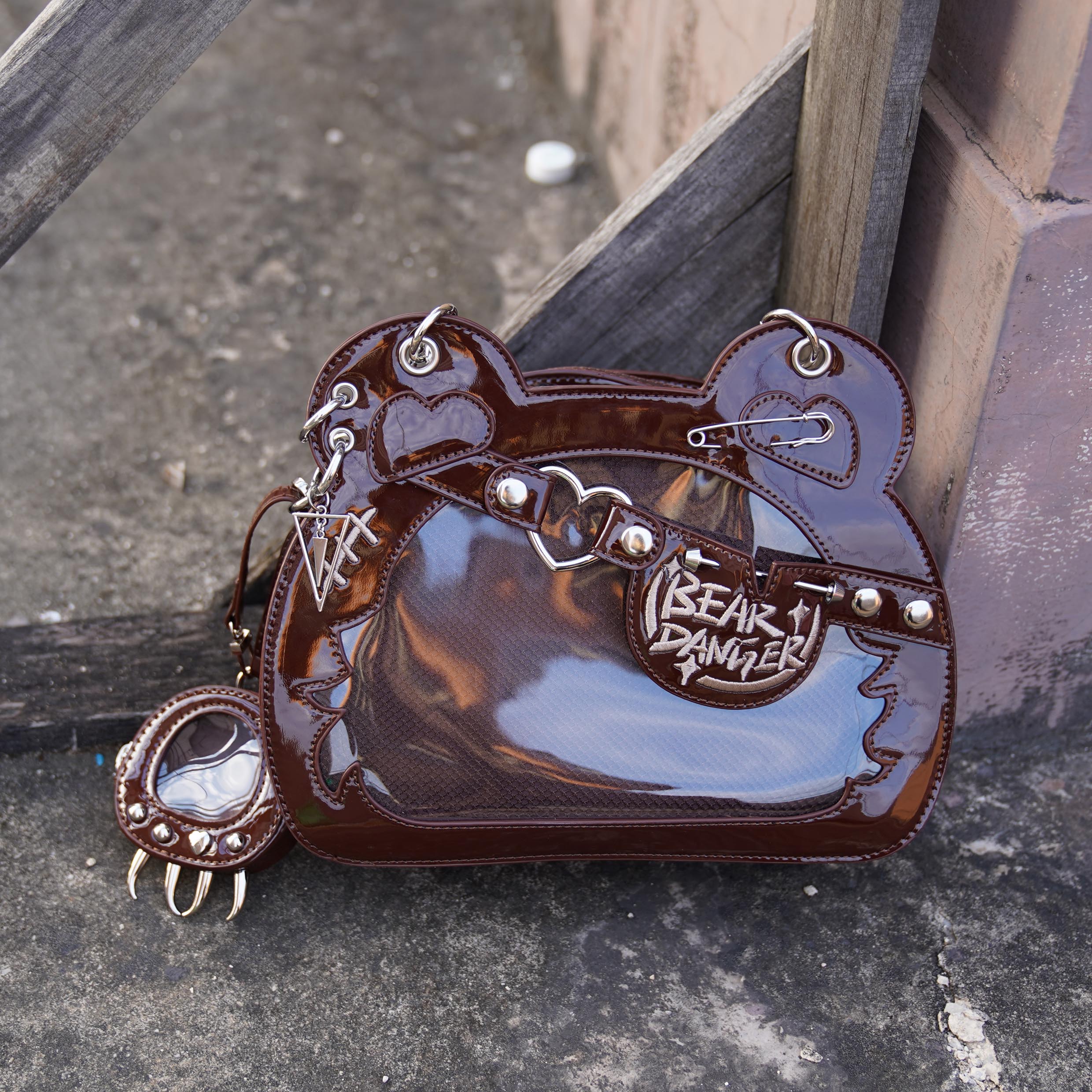 Dark brown patent leather bear-shaped ita bag with punk metal decor and bear paw coin purse, jirai fashion crossbody style