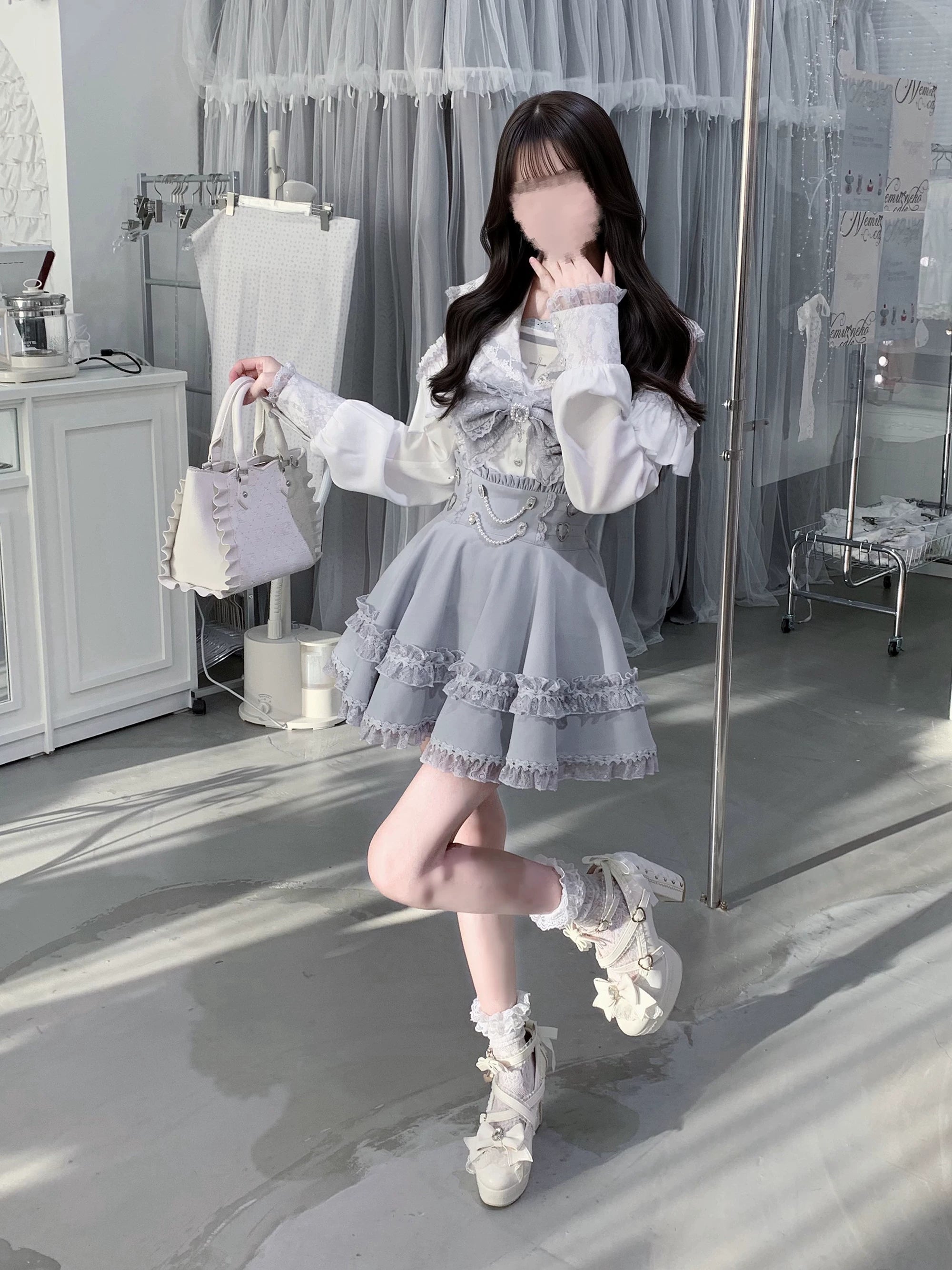 Dynamic side profile view of model wearing ryousangata jirai kei sailor set with crossed legs pose white platform boots and pink handbag accessory in studio setting