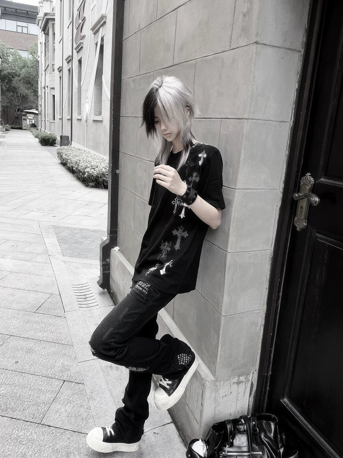 Black gothic cross print t-shirt flat lay showing full garment construction, crew neck, short sleeves, and overall silhouette design