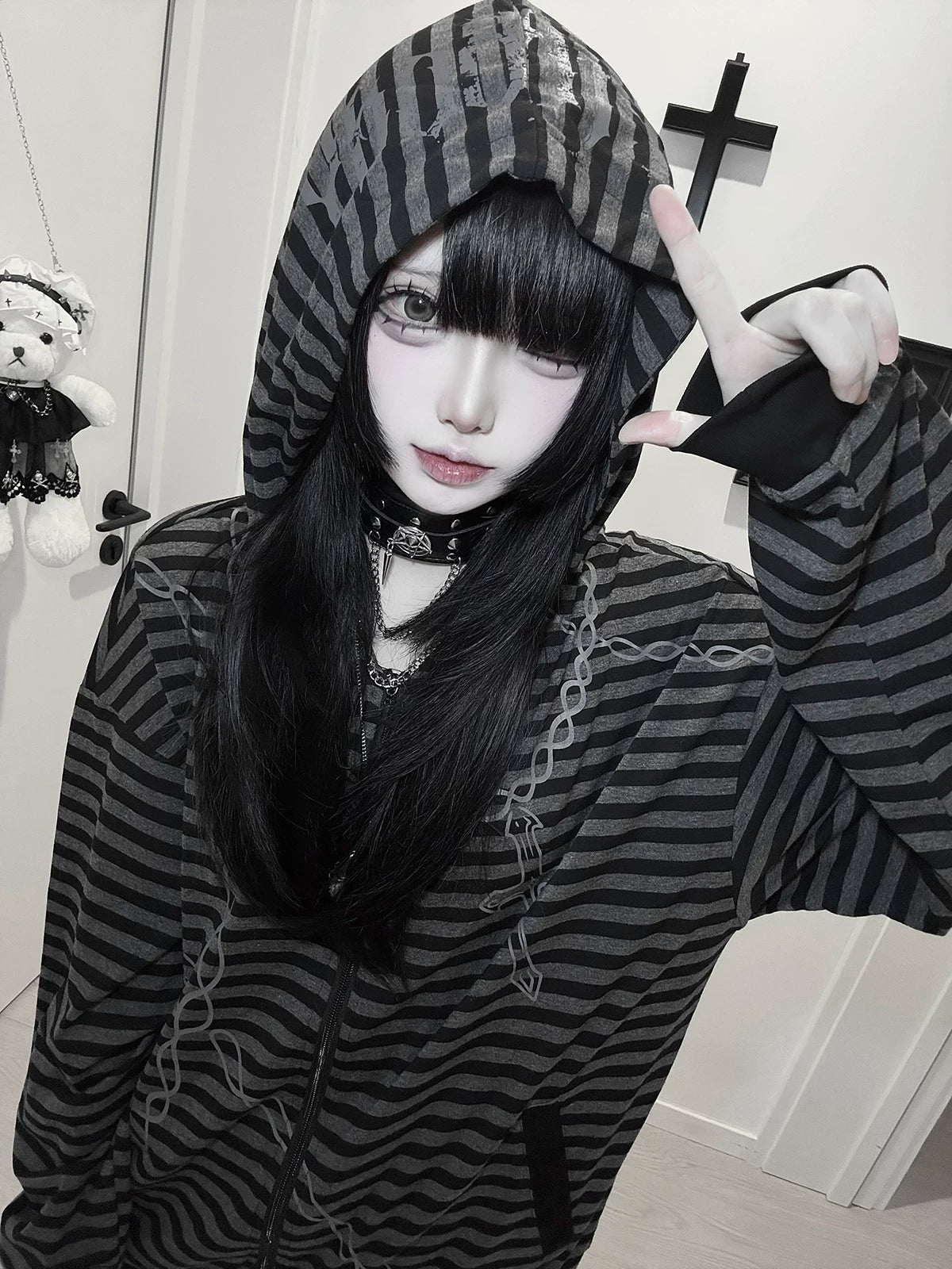 Gothic striped zip-up hoodie alternative festival styling displaying cross and chain print motifs for music venue wear