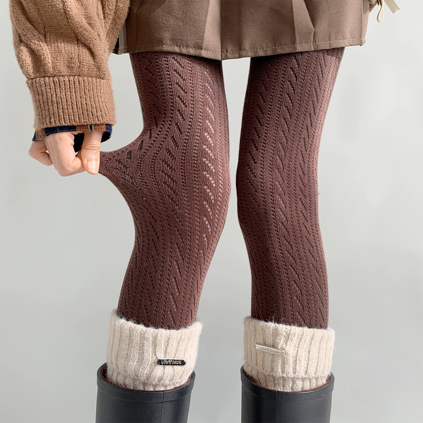 Coffee brown Jirai Kei hollow knit tights worn with camel sweater and mini skirt showing elongating effect