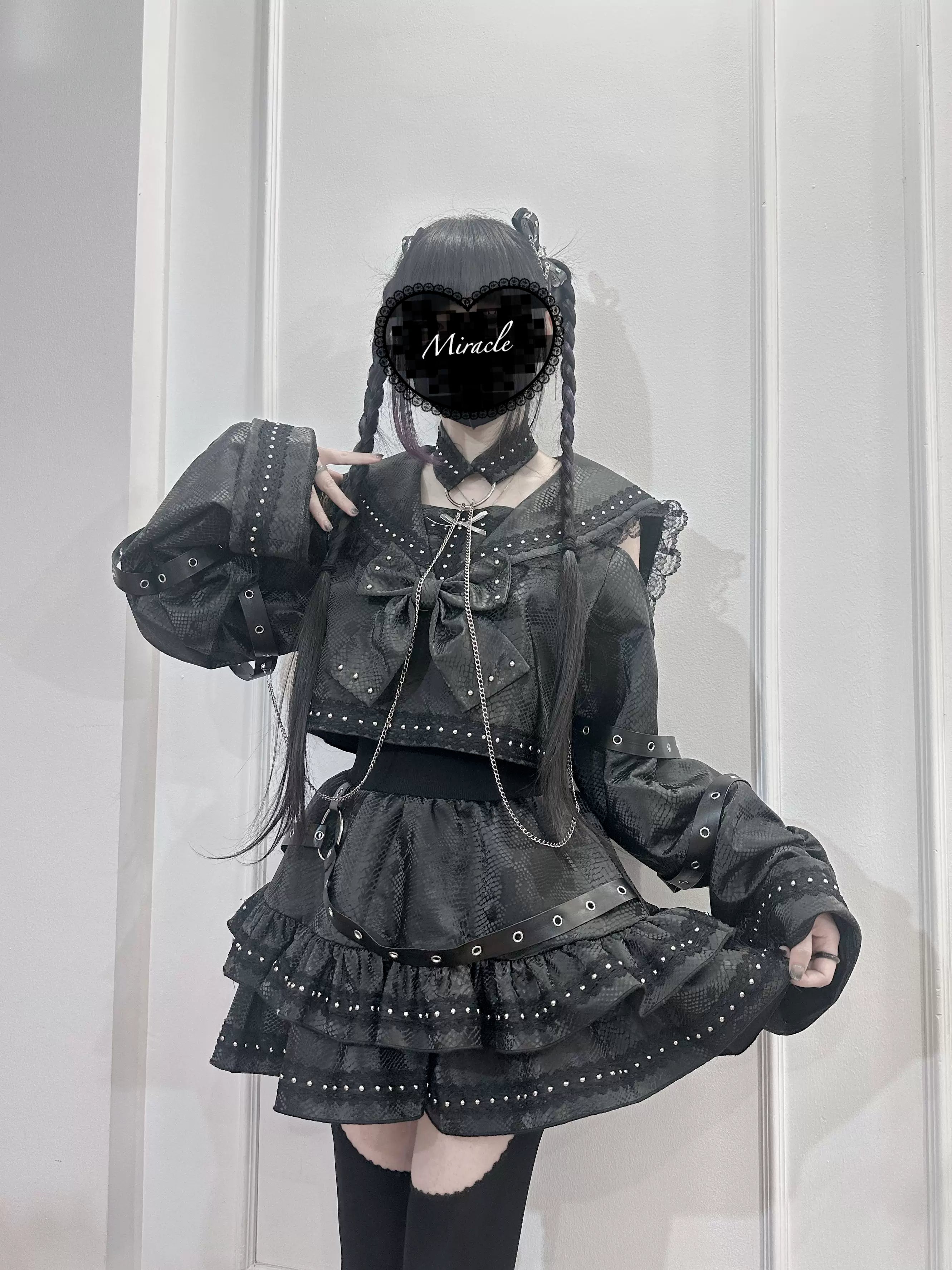 Gothic black two-piece sailor set front three-quarter view on model featuring loose bell sleeves layered ruffled skirt and subculture aesthetic