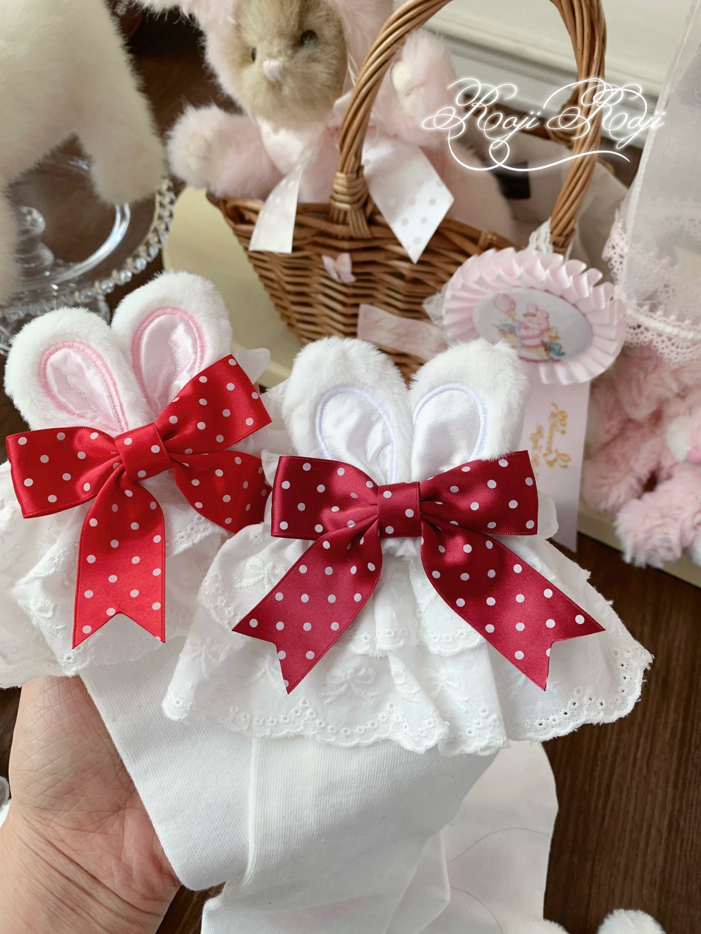 Jirai Kei polka dot bunny ear socks in purple colorway worn with Lolita coordinate and displayed in specialty shop interior