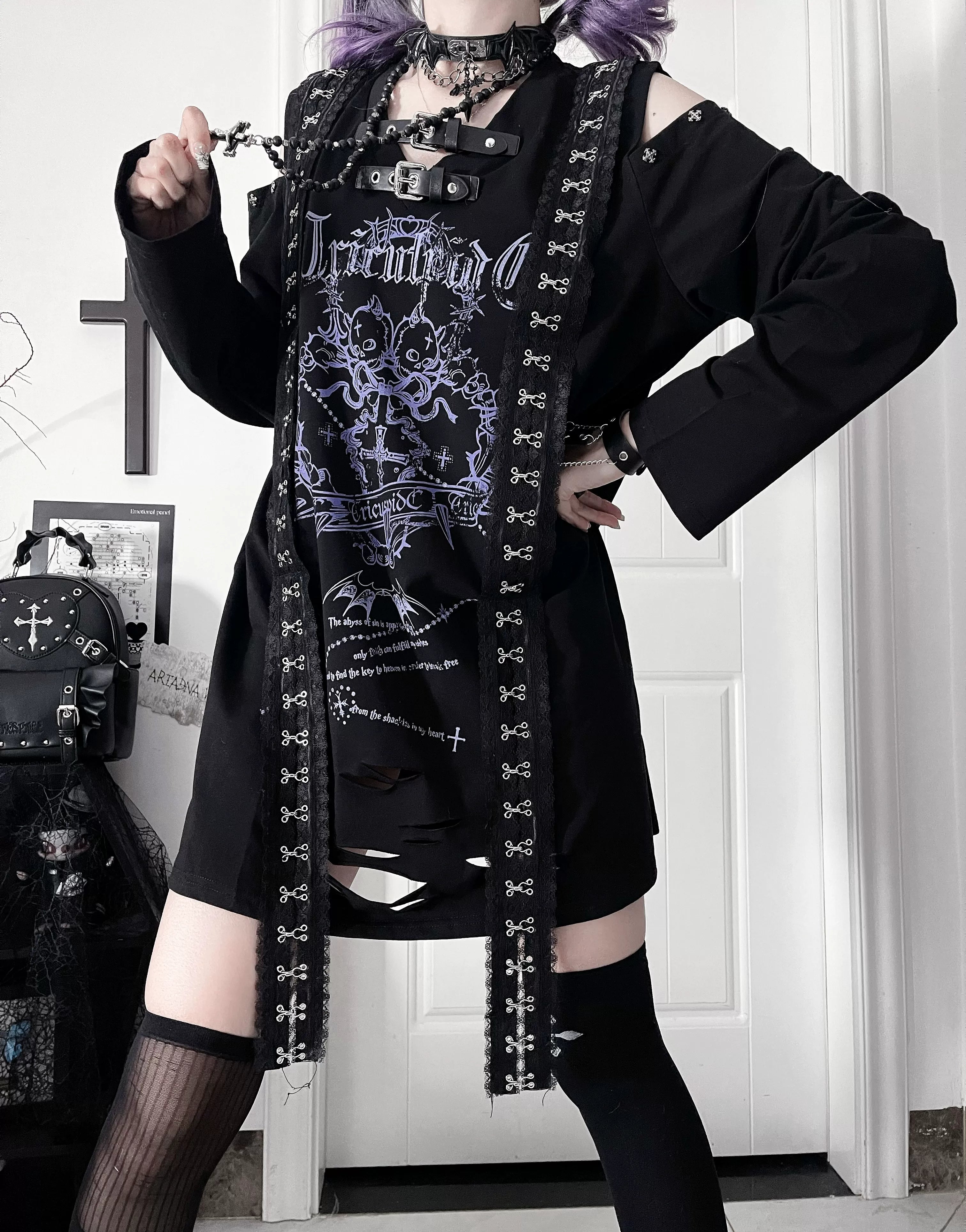Detail shot of belted collar accent on black long-sleeve Jirai Kei tee, showcasing signature neck strap design and rebellious gothic print elements
