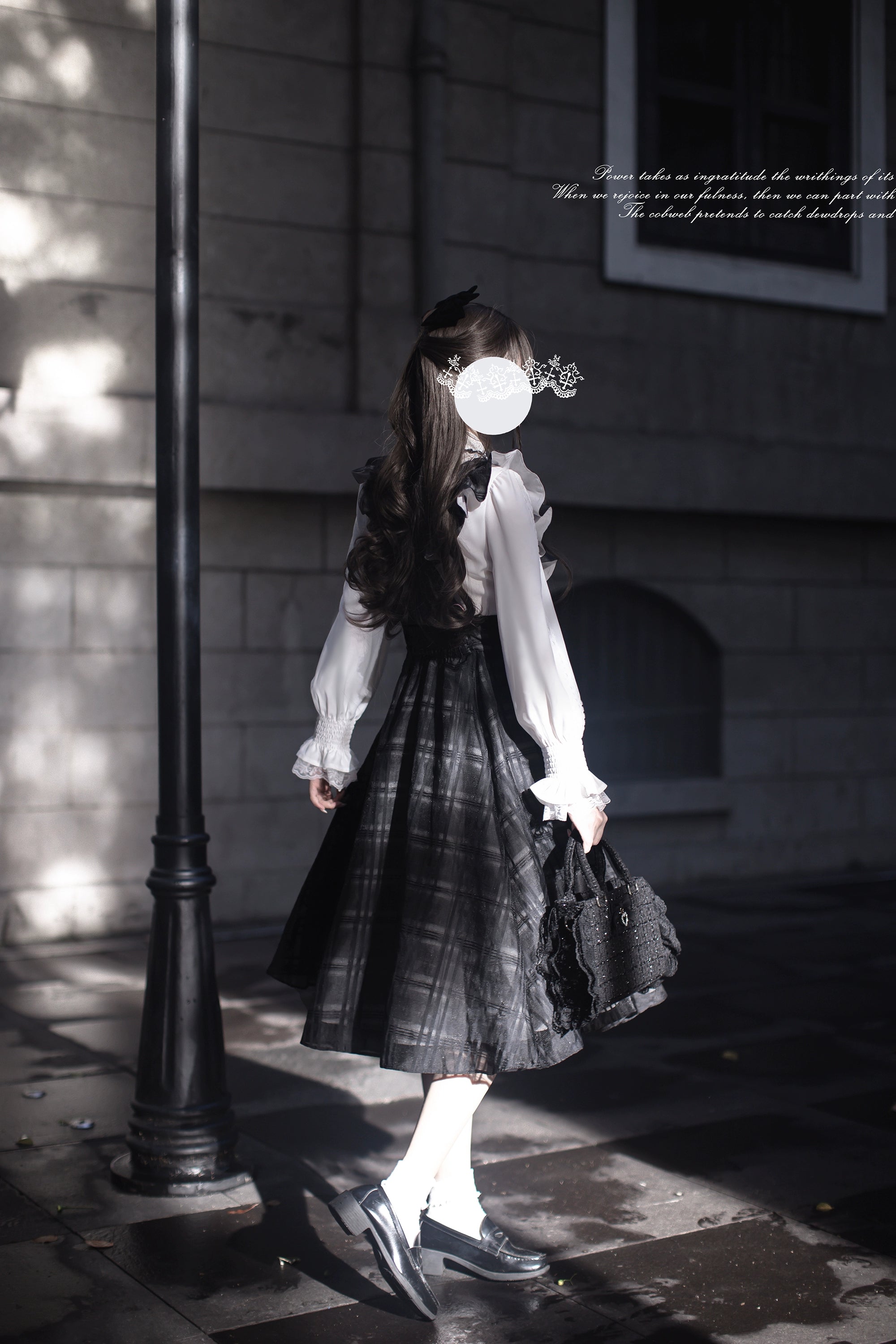 Seiso Kei two-piece outfit back view showing long-sleeve white blouse with lace cuffs paired with dark plaid suspender skirt, model with vintage hair accessories in outdoor street setting
