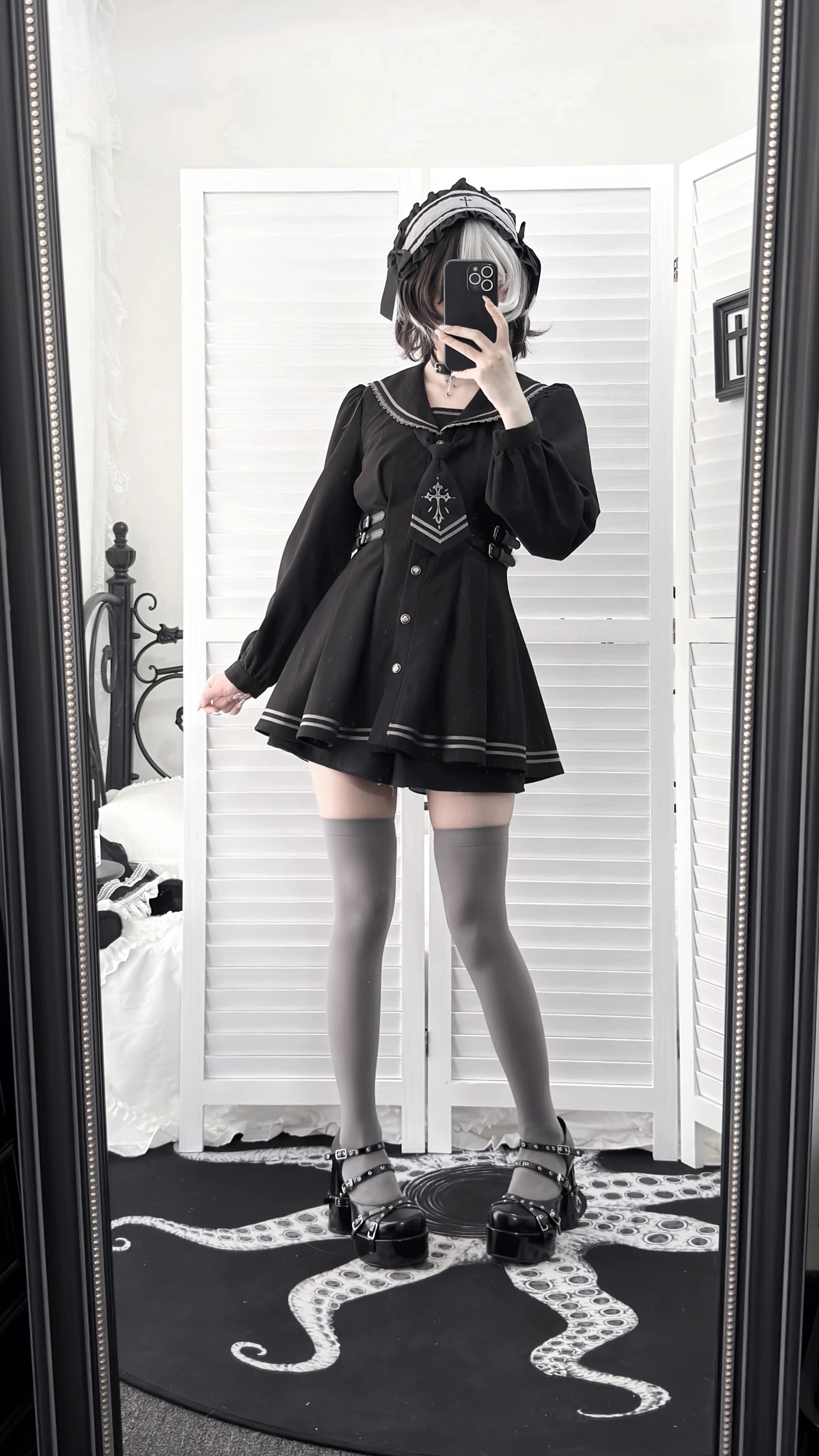 Black sailor collar JK uniform with detachable cross-embroidered necktie, fitted waist construction, and flared skirt silhouette