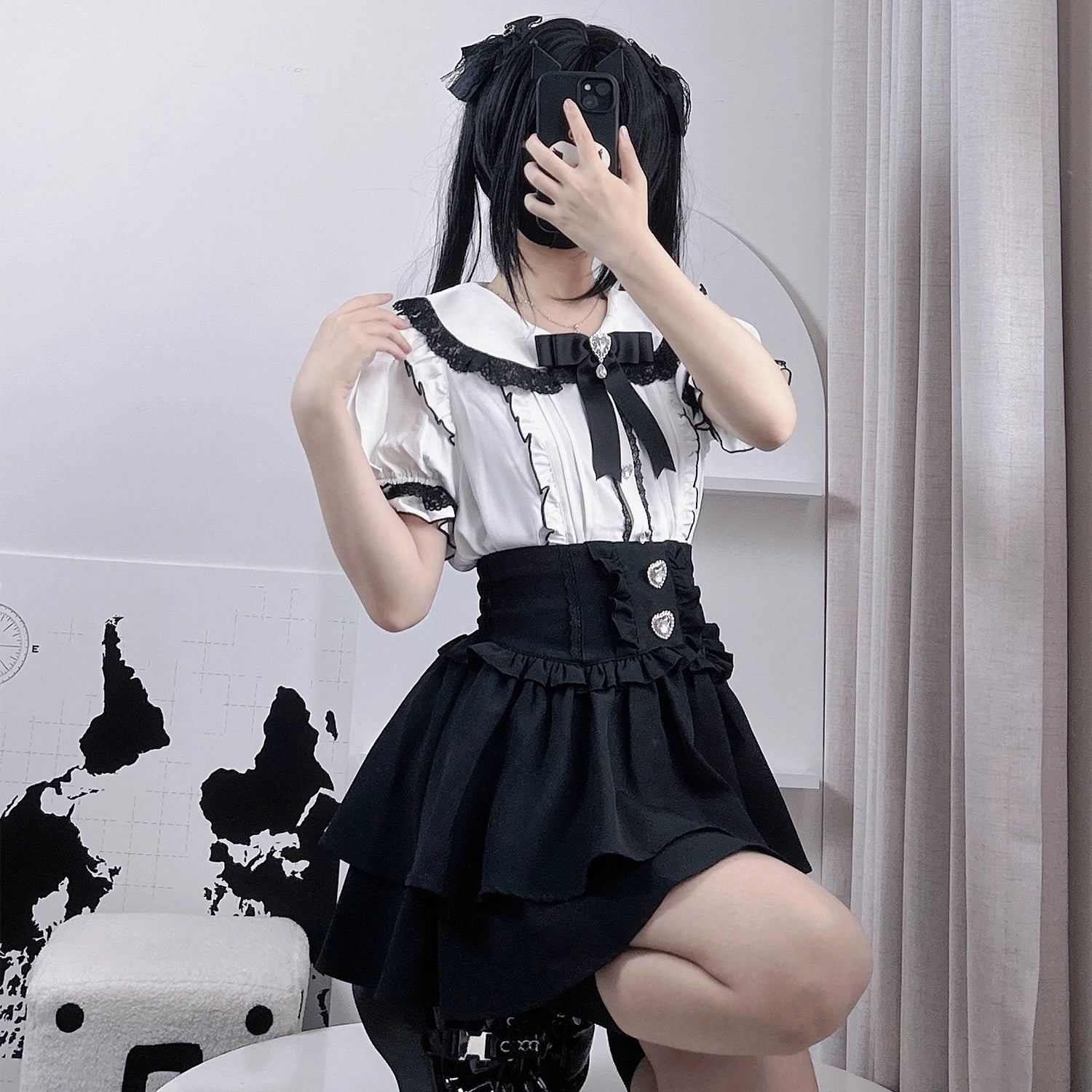 Houndstooth pattern jirai kei tiered mini skirt closeup, showing plaid texture and ruffled layers detail, polyester fabric quality