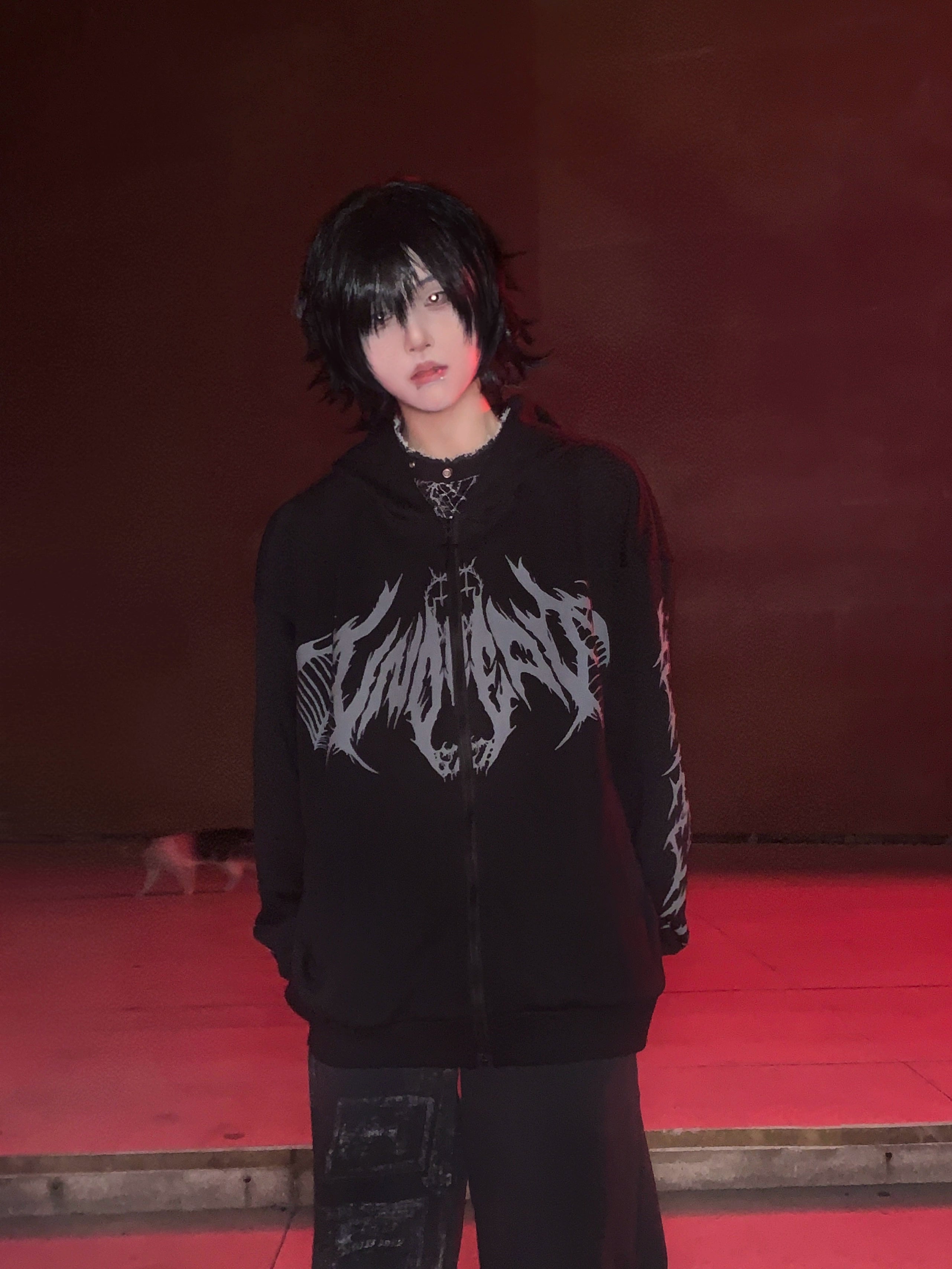 Jirai Kei gothic zip hoodie detail shot showing intricate bone wing print texture and craftsmanship, close-up of punk graphic design and fabric quality