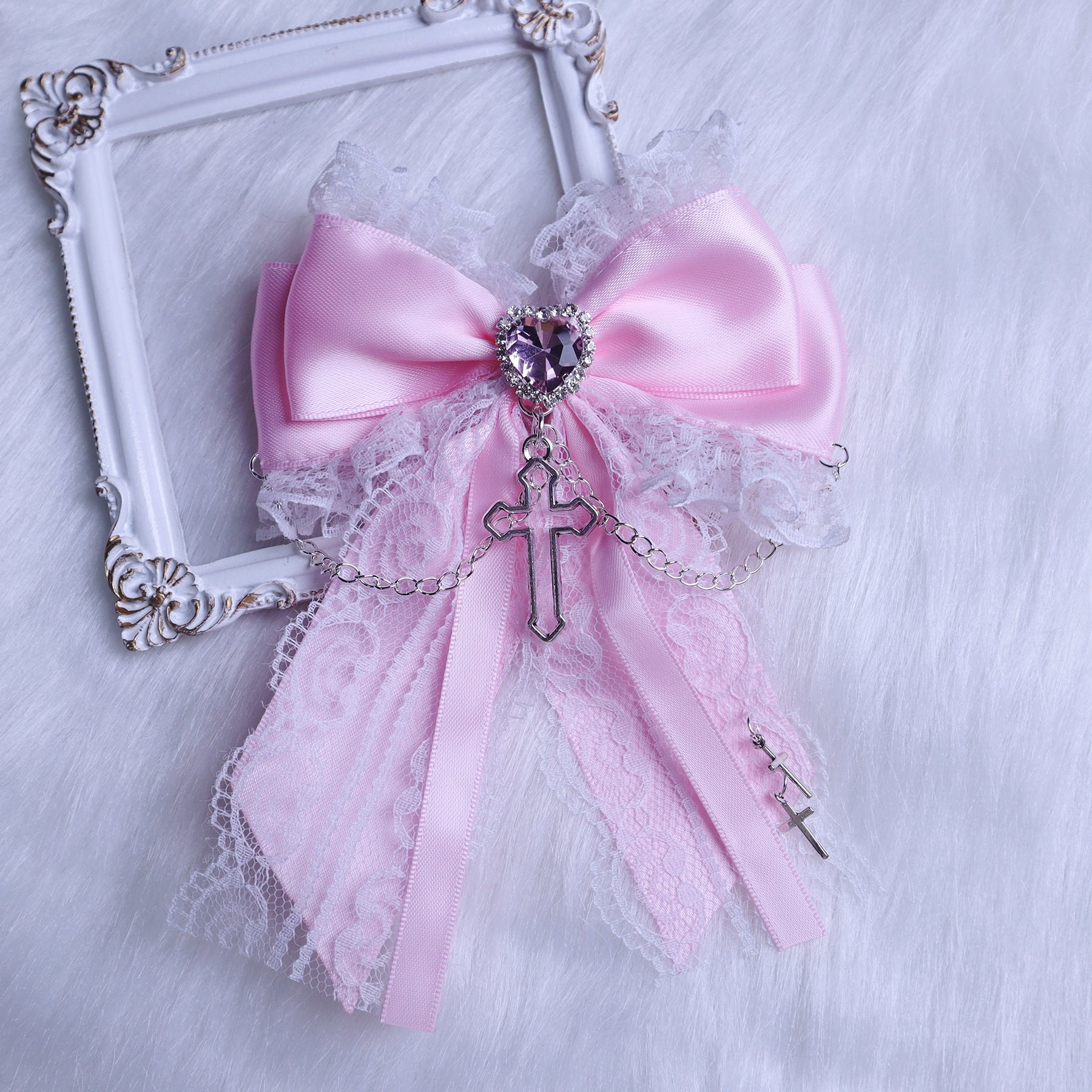 White-pink sweet Jirai Kei bow hair clip with cross and heart rhinestone decorations, perfect for gothic lolita and feminine styling