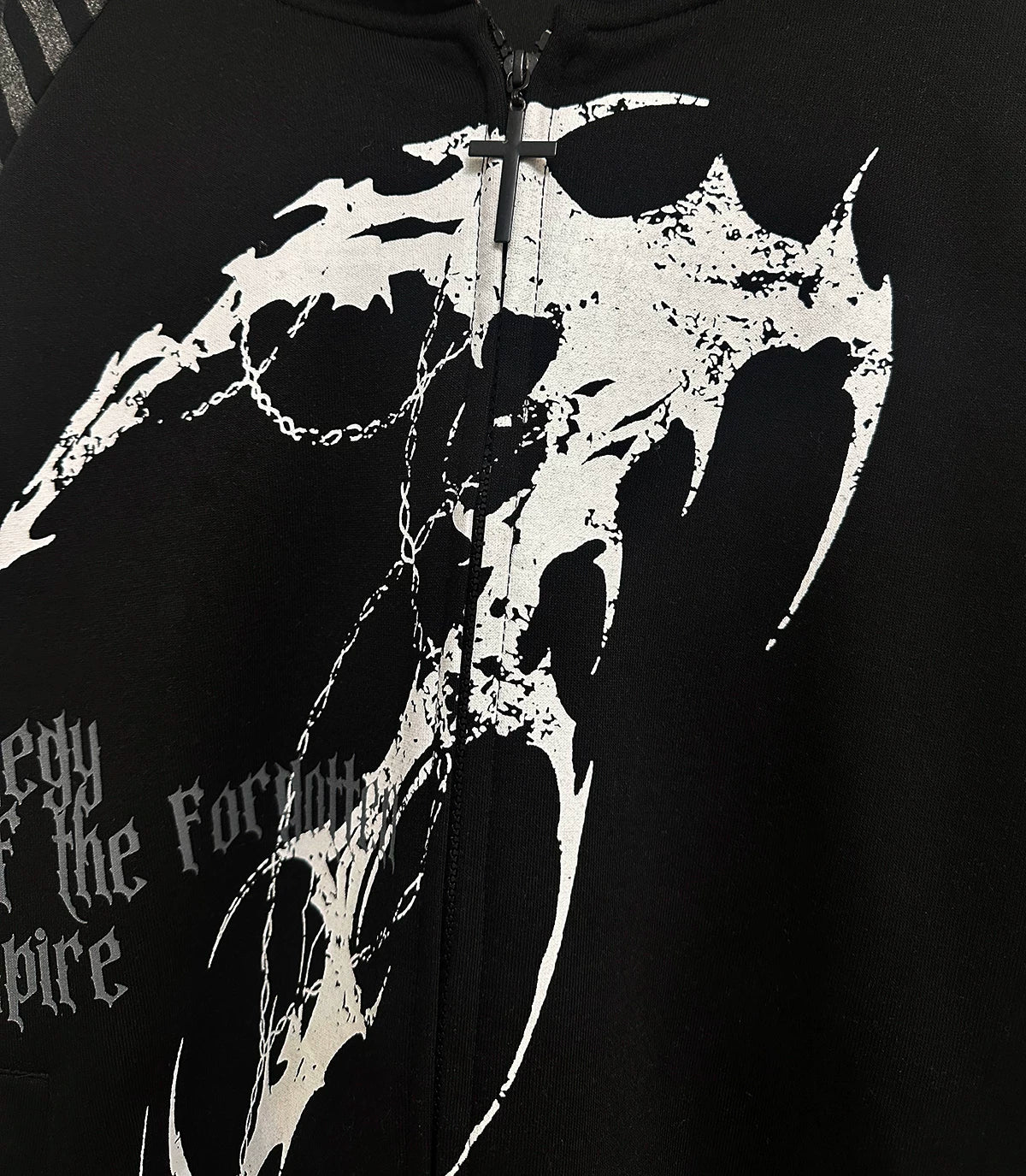 Hooded scythe print zip coat material close-up showing cotton blend fabric quality and scythe print graphics durability
