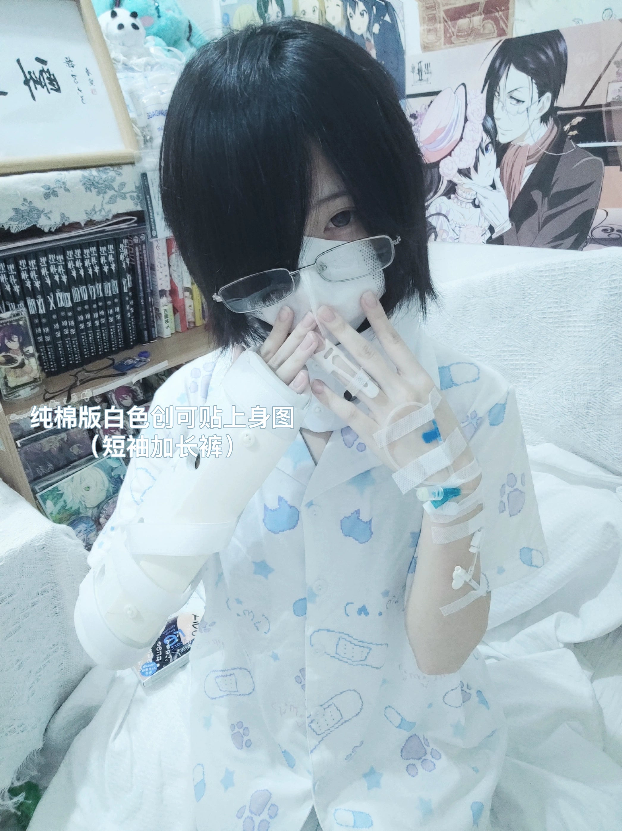 White Tenshi Kaiwai cat print pajama set with long sleeves and pants worn by female model in bedroom with anime posters, front selfie wearing mask and glasses