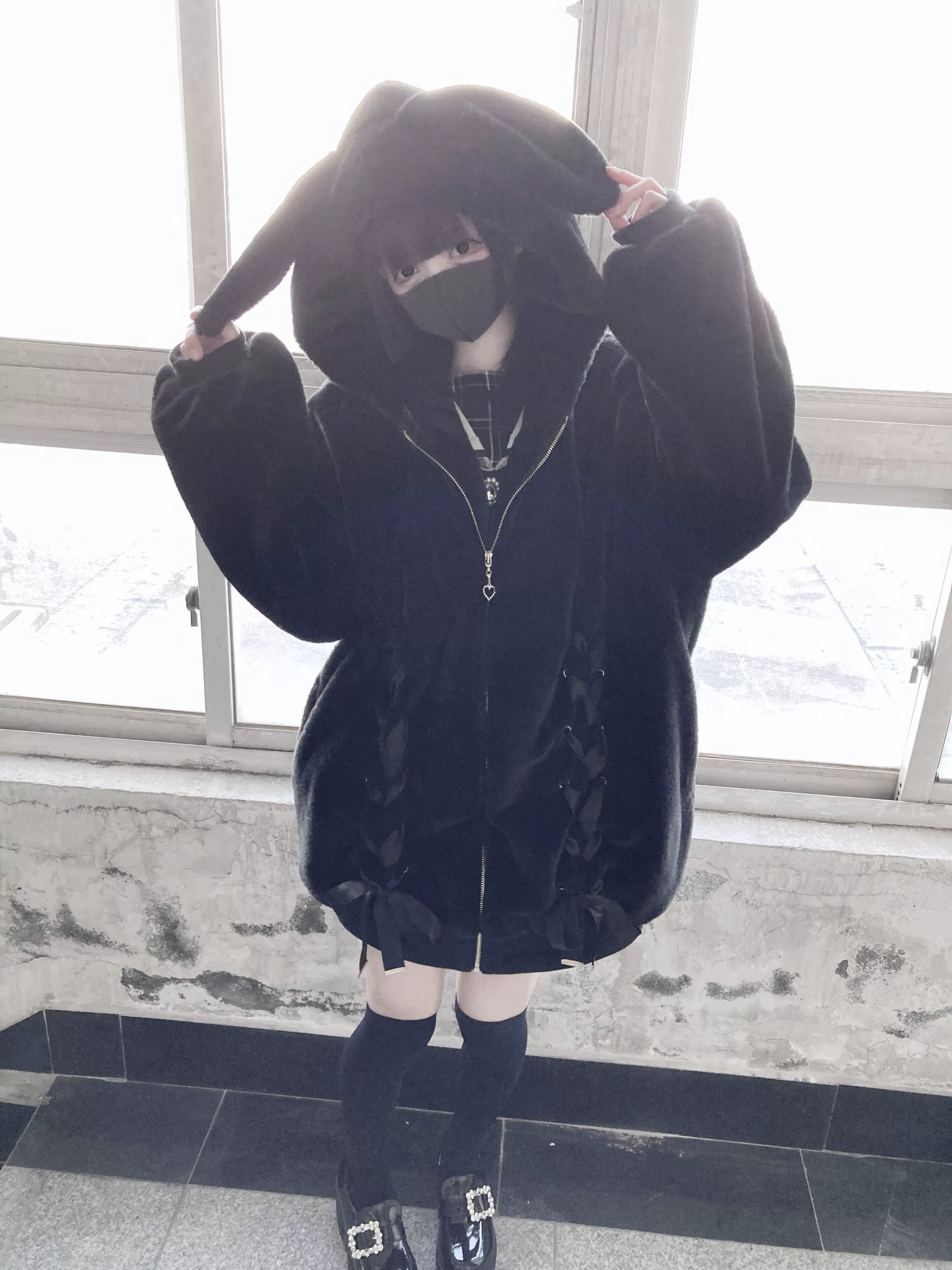Black bunny-eared hooded plush coat complete front view highlighting bunny ears hood heart zipper