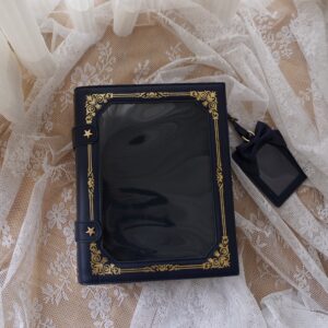 Navy blue vintage grimoire Jirai Kei ita crossbody bag with gold antique border star fasteners flat lay on lace