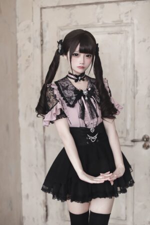 Pink and black Jirai Kei lace ruffle blouse with heart buttons worn with twin-tail hairstyle front full body view