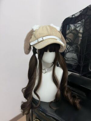 Brown puppy ear newsboy cap with leather buckle displayed on dark brown twin curly wig mannequin Jirai Kei kawaii hat aesthetic