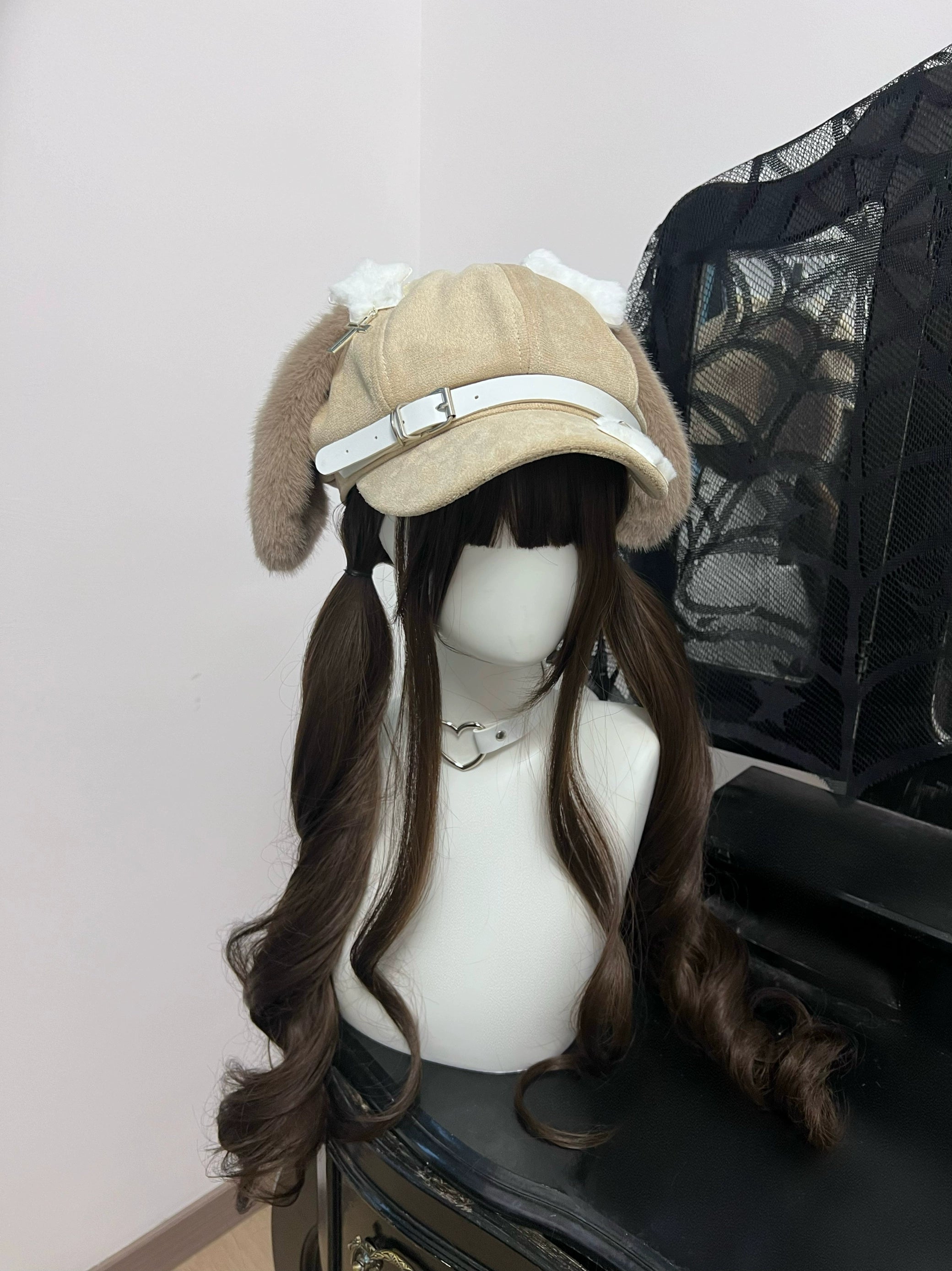 Jirai Kei brown puppy ear newsboy cap kawaii hat with white leather strap detail on dark wig mannequin