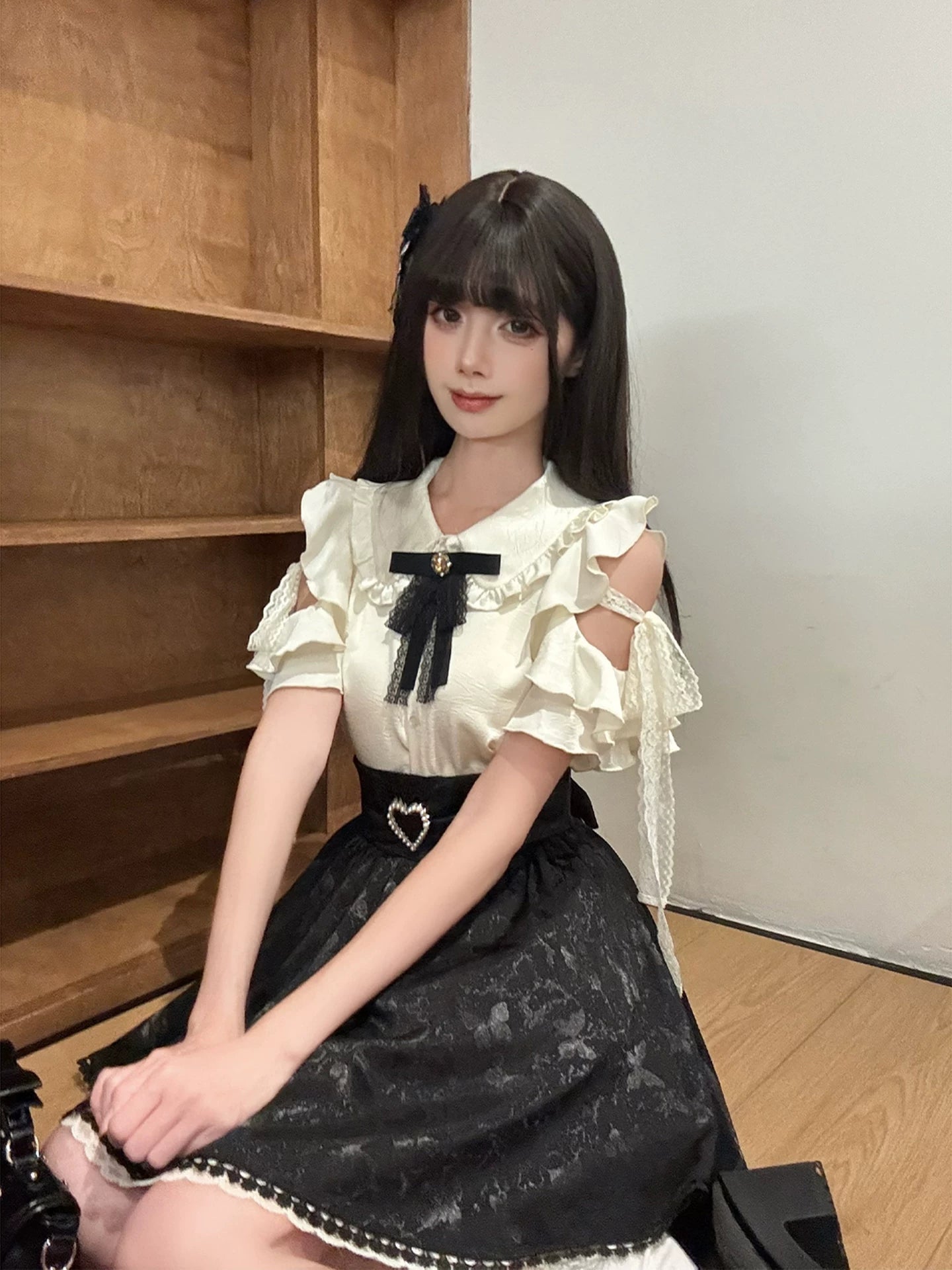 Side view of Seiso Kei butterfly jacquard skirt showing pearl trim and elegant slit hem design