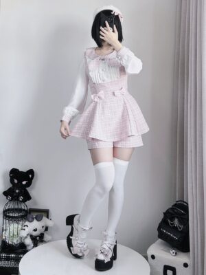 Pink plaid Jirai Kei two-piece outfit set with bow collar and waist trim worn by model in full front standing view showcasing long-sleeve dress and coordinating shorts