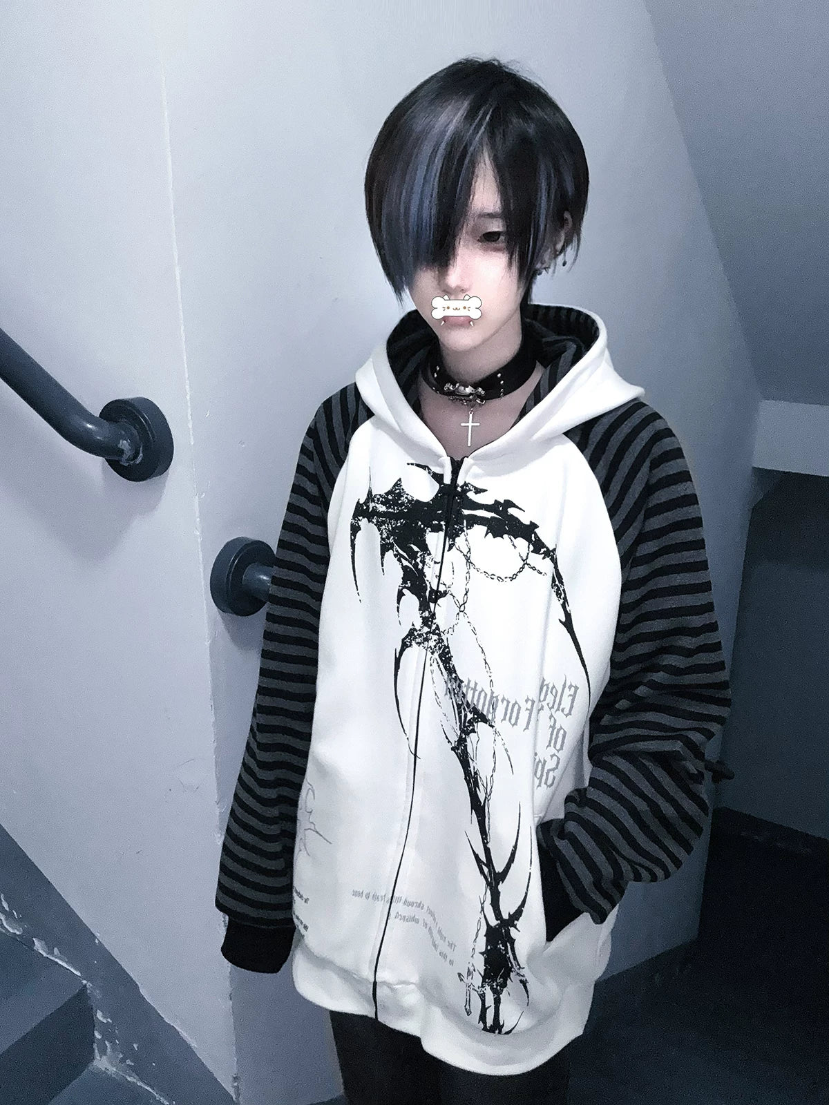 White hooded scythe print zip coat with contrasting grey striped raglan sleeves front model view stairwell indoor setting Jirai Kei subculture fashion
