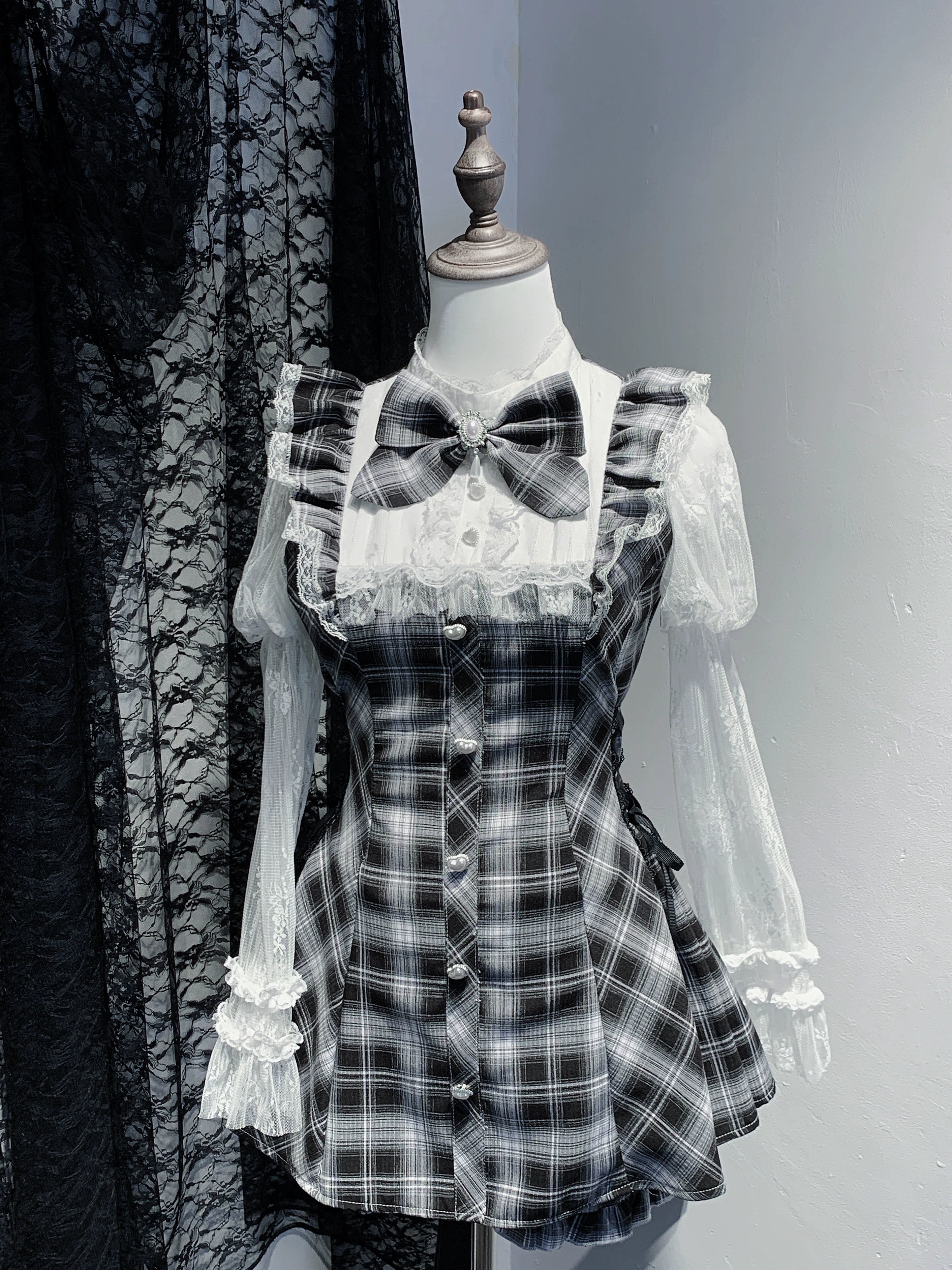 Black and white plaid Jirai Kei dress with matching elastic shorts lace Julie sleeves detachable bow and functional back zipper complete outfit display