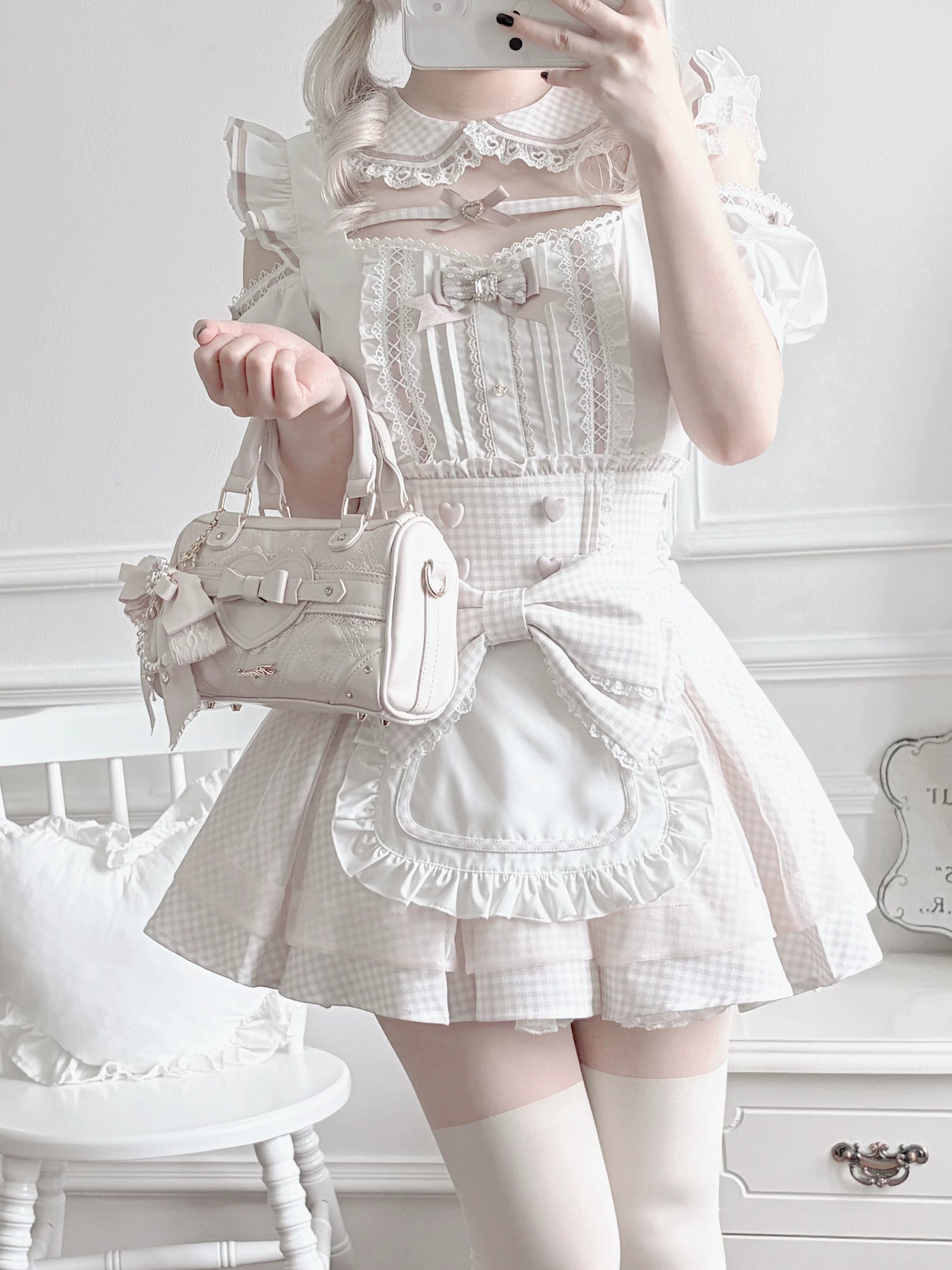 Close-up half-body view of Jirai Kei maid blouse with white gingham lace trim details, square neckline, and matching structured handbag accessory