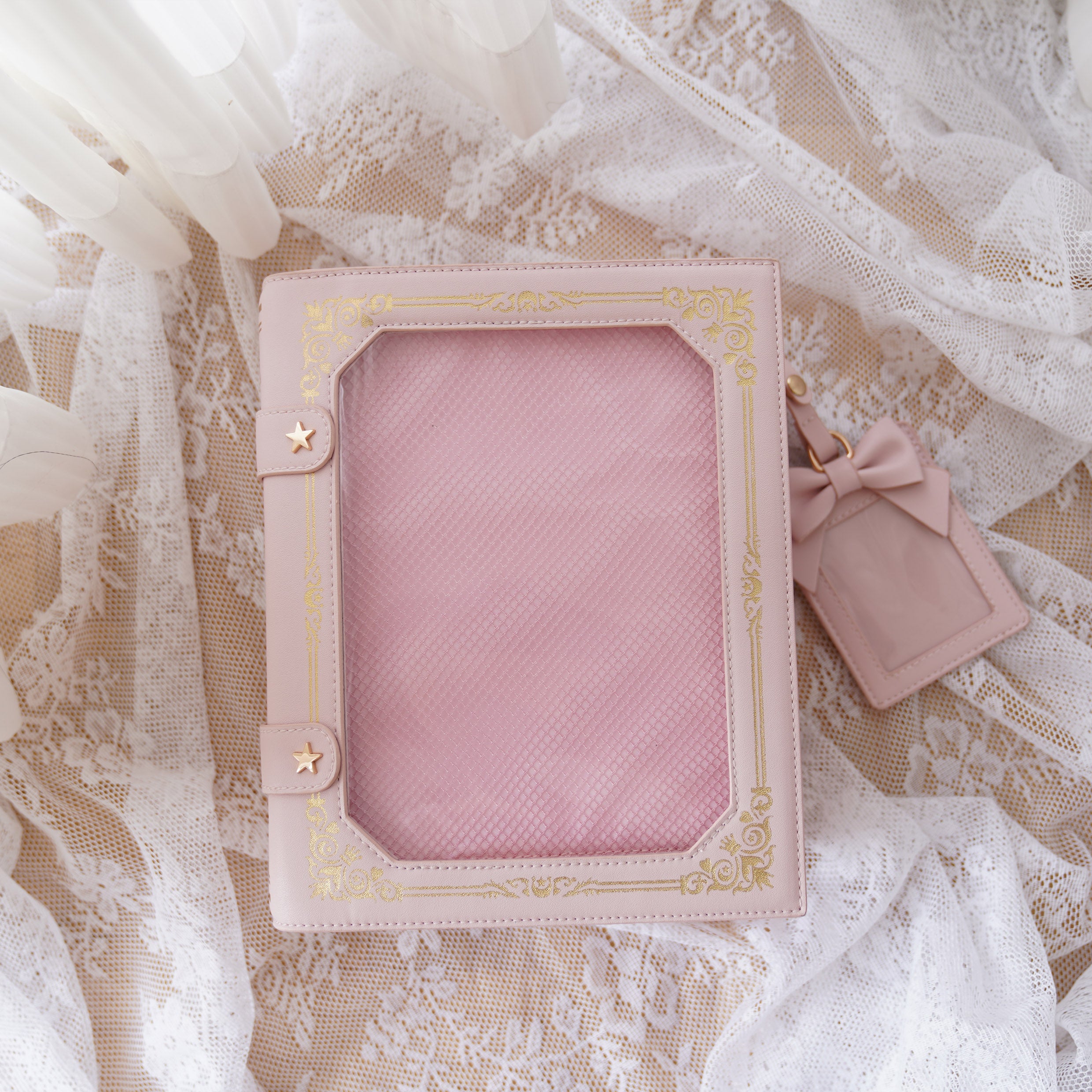 Pink vintage grimoire Jirai Kei ita crossbody bag with light pink border and matching bow card pouch flat lay