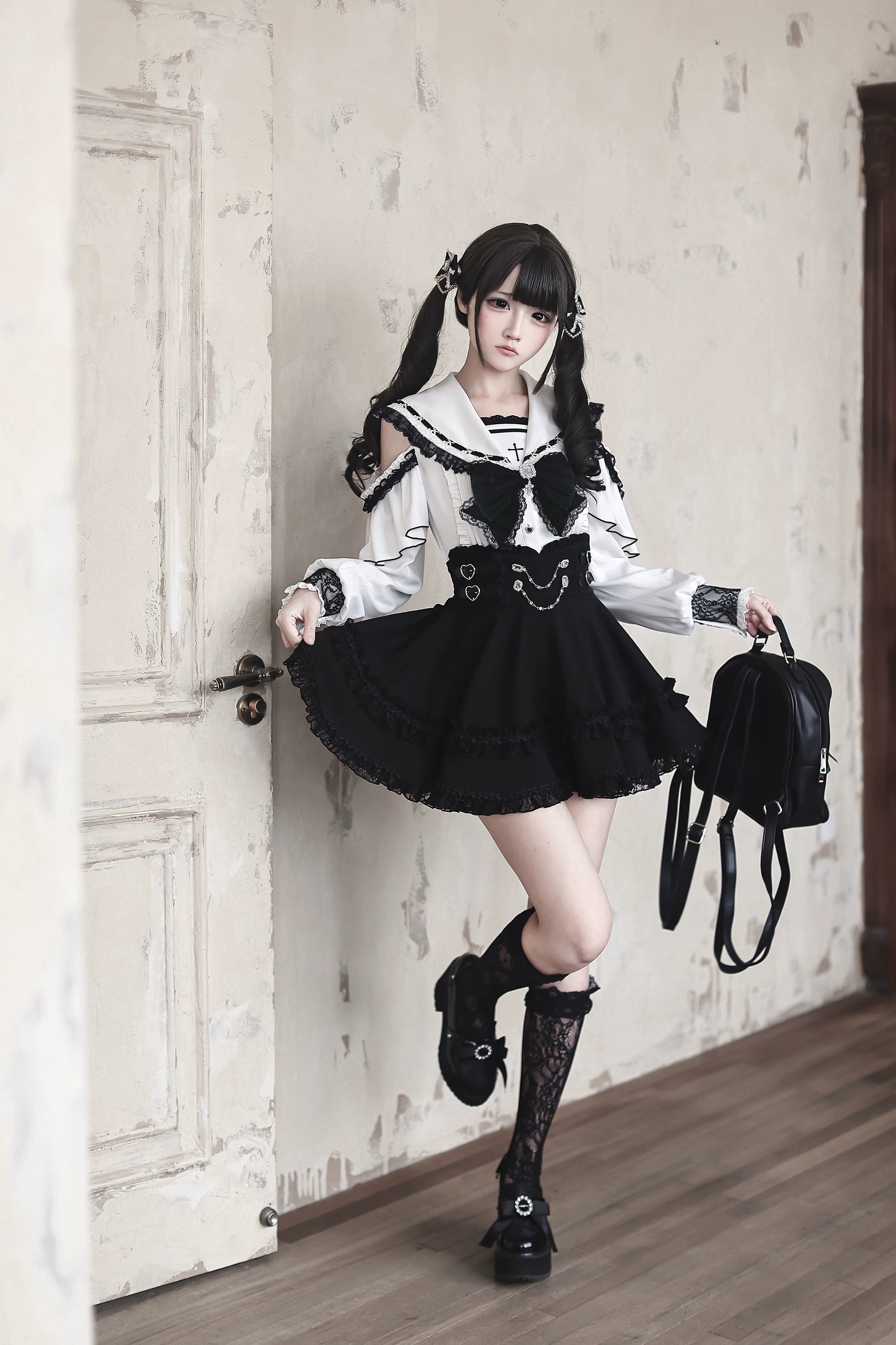 Sailor collar Jirai Kei outfit flatlay showing all components including lace trim, rhinestone bow, chain buckles, and polyester fabric quality