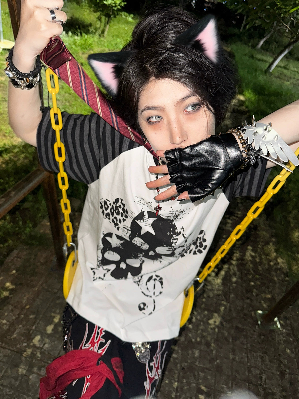 Black jirai kei gothic skull raglan t-shirt flat lay product photography front center composition