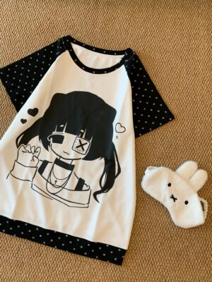 Jirai Kei monochromatic cartoon girl print raglan t-shirt flat lay top down view with plush eye mask aesthetic styling