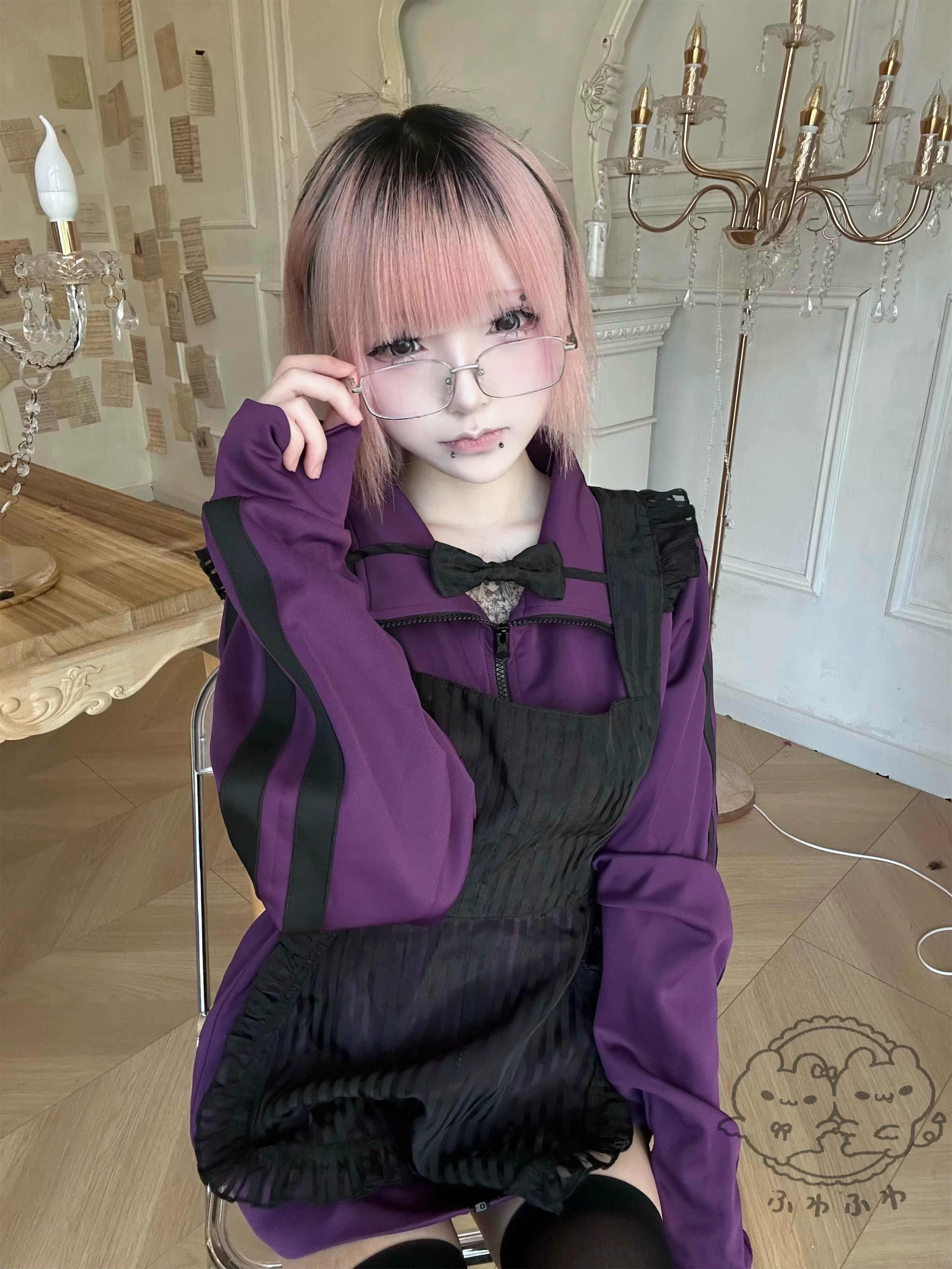 jirai kei purple track jacket maid apron outfit thigh highs seated model vintage aesthetic