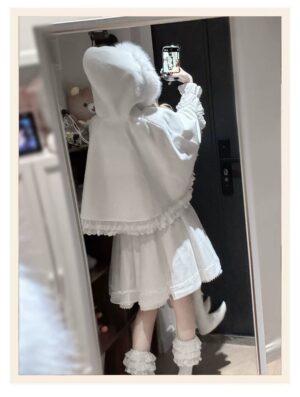 White hooded cape with faux fur collar and scalloped lace hem worn with ruffled high-waist skirt, back mirror view