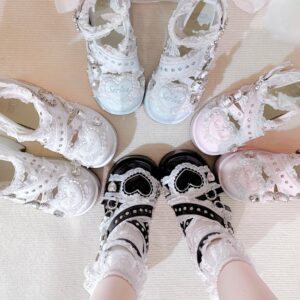 White heart-shaped Jirai Kei platform shoes with lace socks flat lay top down view cutout design