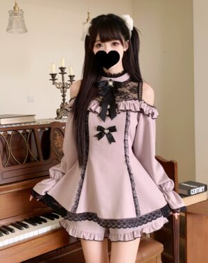 Pink gothic lolita off-shoulder dress shorts ensemble with black lace trim ruffled hem and bow decorations indoor scene