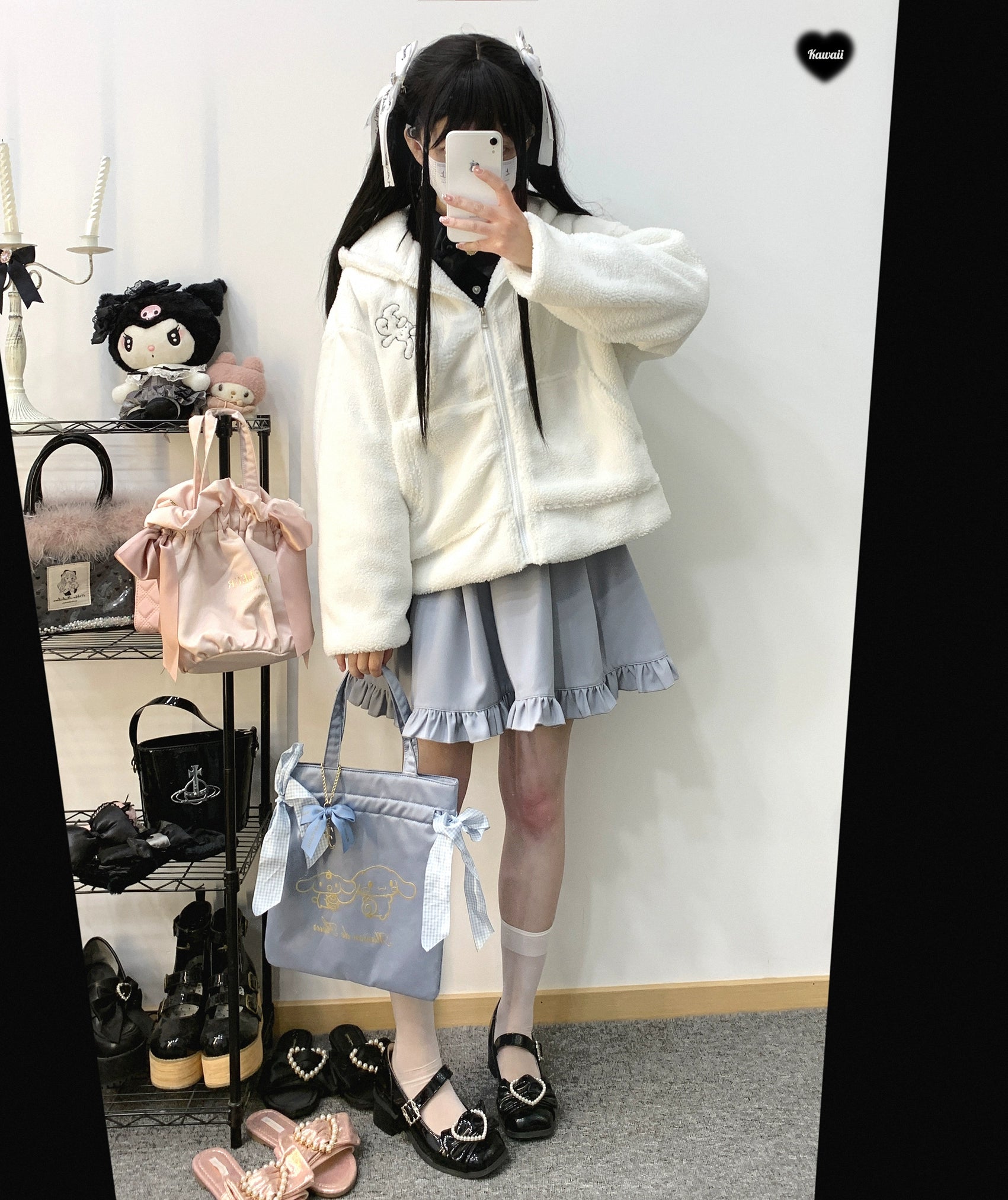 Back view Jirai Kei suspender skirt showing shirring detail ruffled hem construction and heart buckle waistband from rear angle