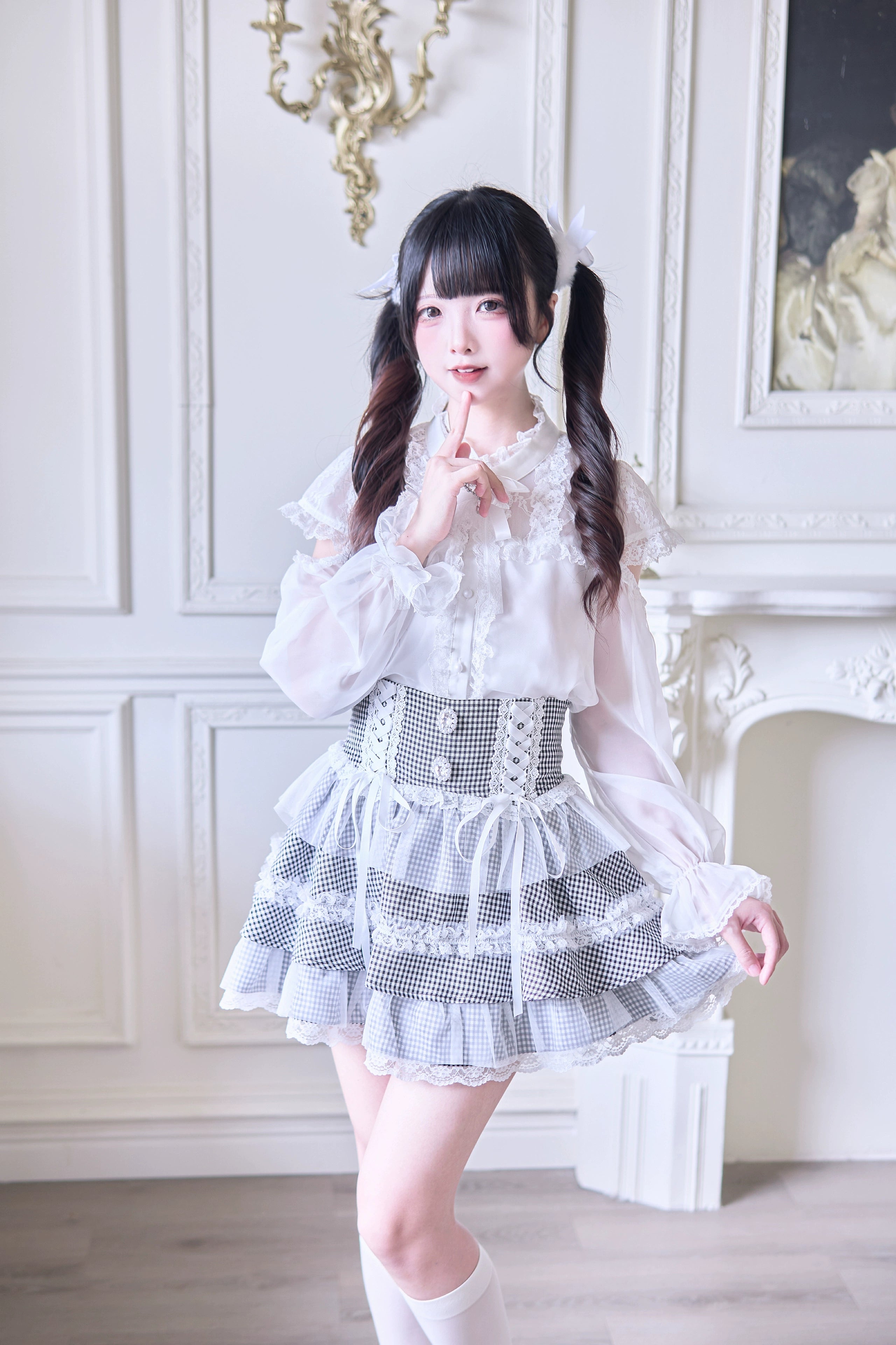 Full-body front view of tiered lace Jirai Kei skirt in classic houndstooth pattern with vintage European aesthetic