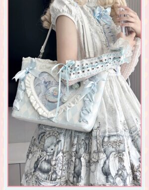 Itabag transparent heart window jirai kei side angle three-quarter view blonde model lace arm accessory light blue color scheme lolita dress