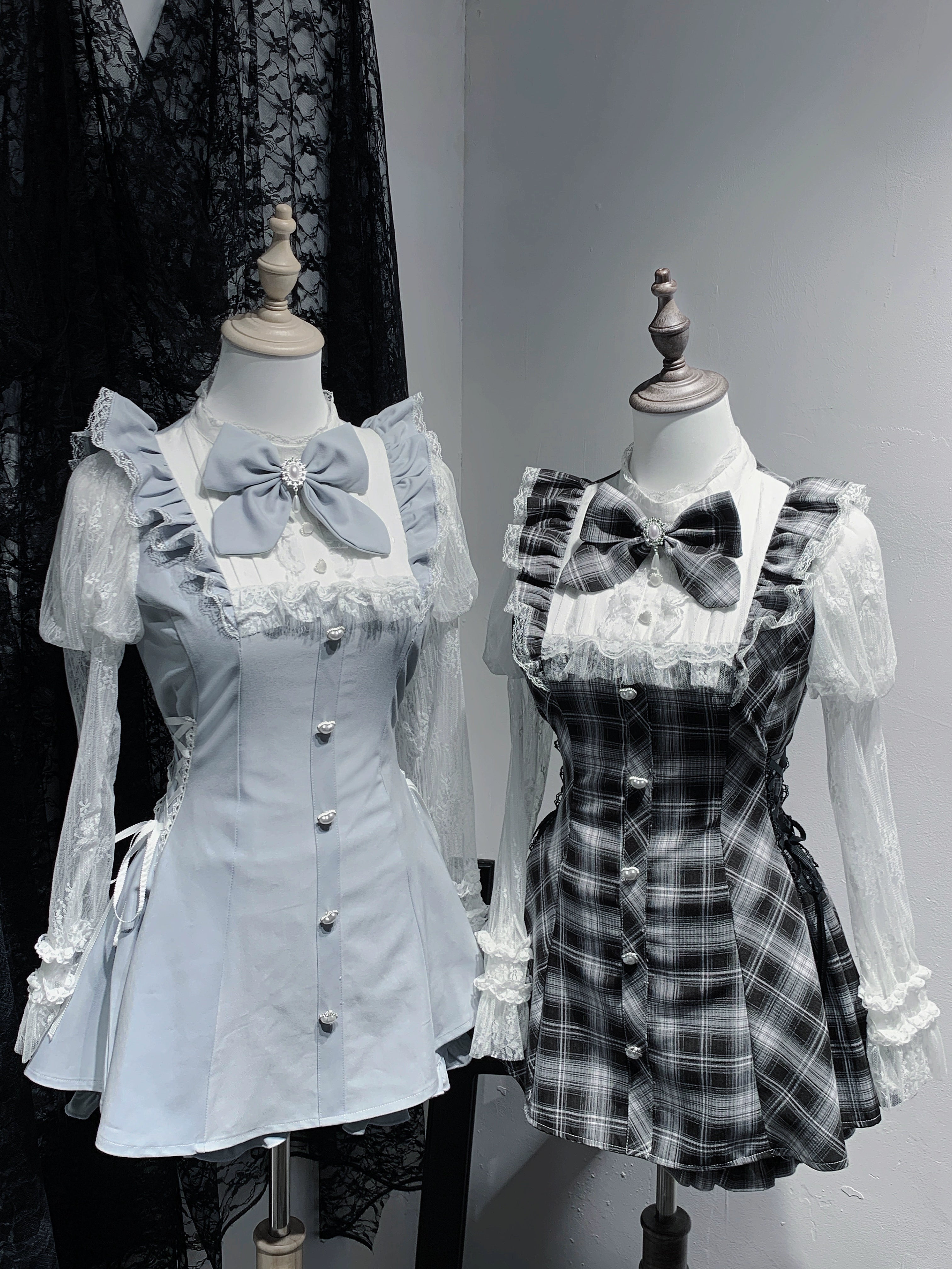 Jirai Kei style lace Julie sleeve dress with elastic shorts and detachable bow in water blue and black plaid options displayed on mannequin with ruffled collar and pearl button details