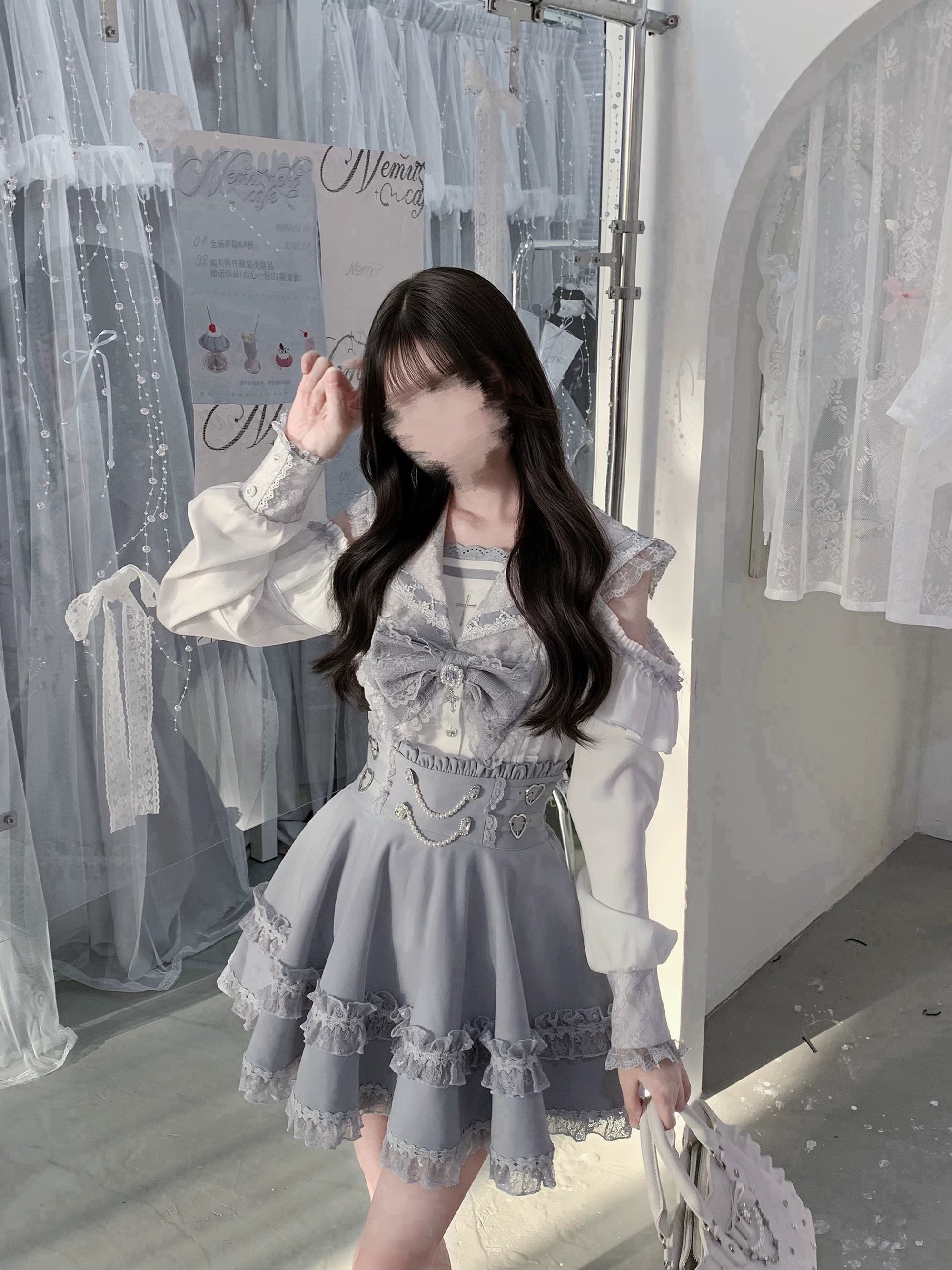 Low angle front three-quarter view of ryousangata jirai kei sailor collar blouse and skirt highlighting detachable chest bow design ruffled hem and overall silhouette elegance