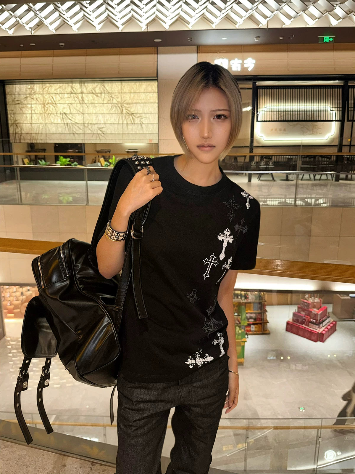 Black Jirai Kei cross print t-shirt unisex fit worn by model, suitable for couples styling and matching alternative fashion statement