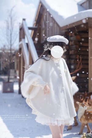 Side back view of white wool Jirai Kei cloak with loose A-line silhouette, frilled under skirt hem, and elegant drape