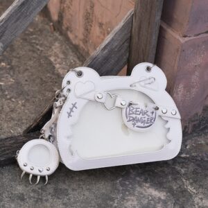 White patent leather bear-shaped jirai kei ita bag with punk metal embellishments and matching bear paw coin purse, front view