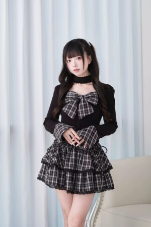 Black Jirai Kei choker knit top with plaid bow and flared patchwork cuffs front view studio shot