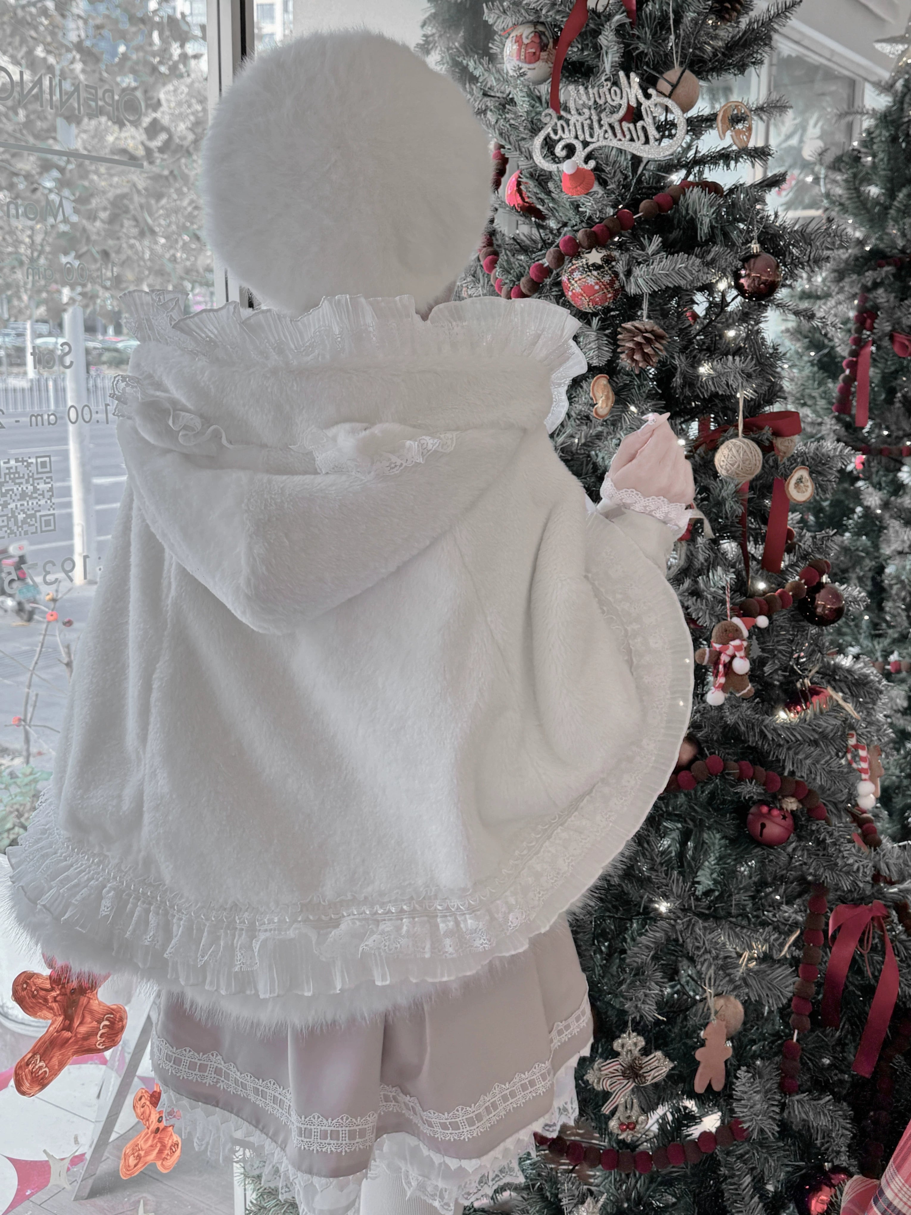 Dark moody aesthetic styling of black jirai kei cat ear fleece cape coat in gothic and sophisticated themed outfit arrangement
