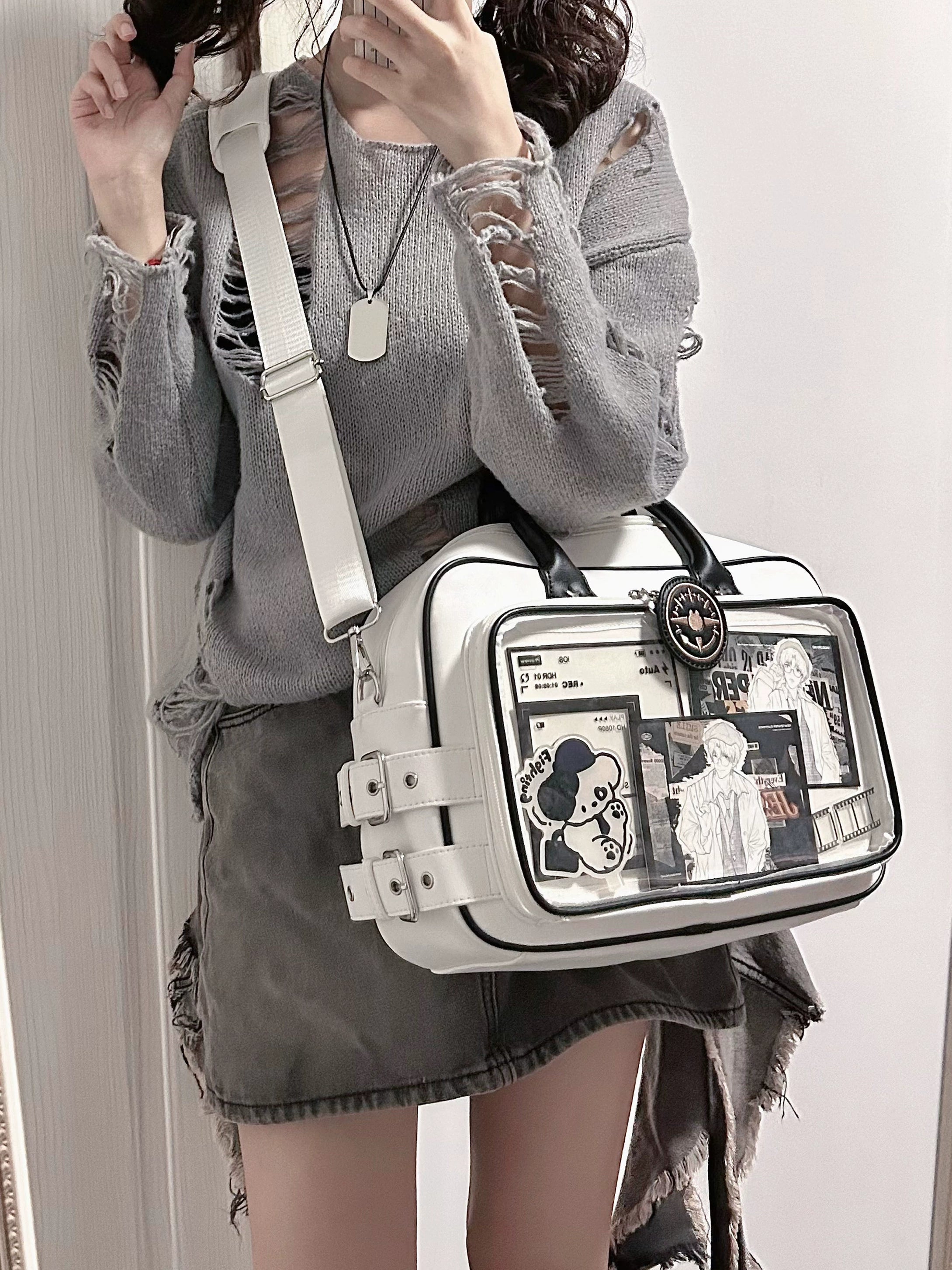 Jirai Kei anime ita bag interior organization showing multiple compartments and pockets for collectible storage and essential items arrangement